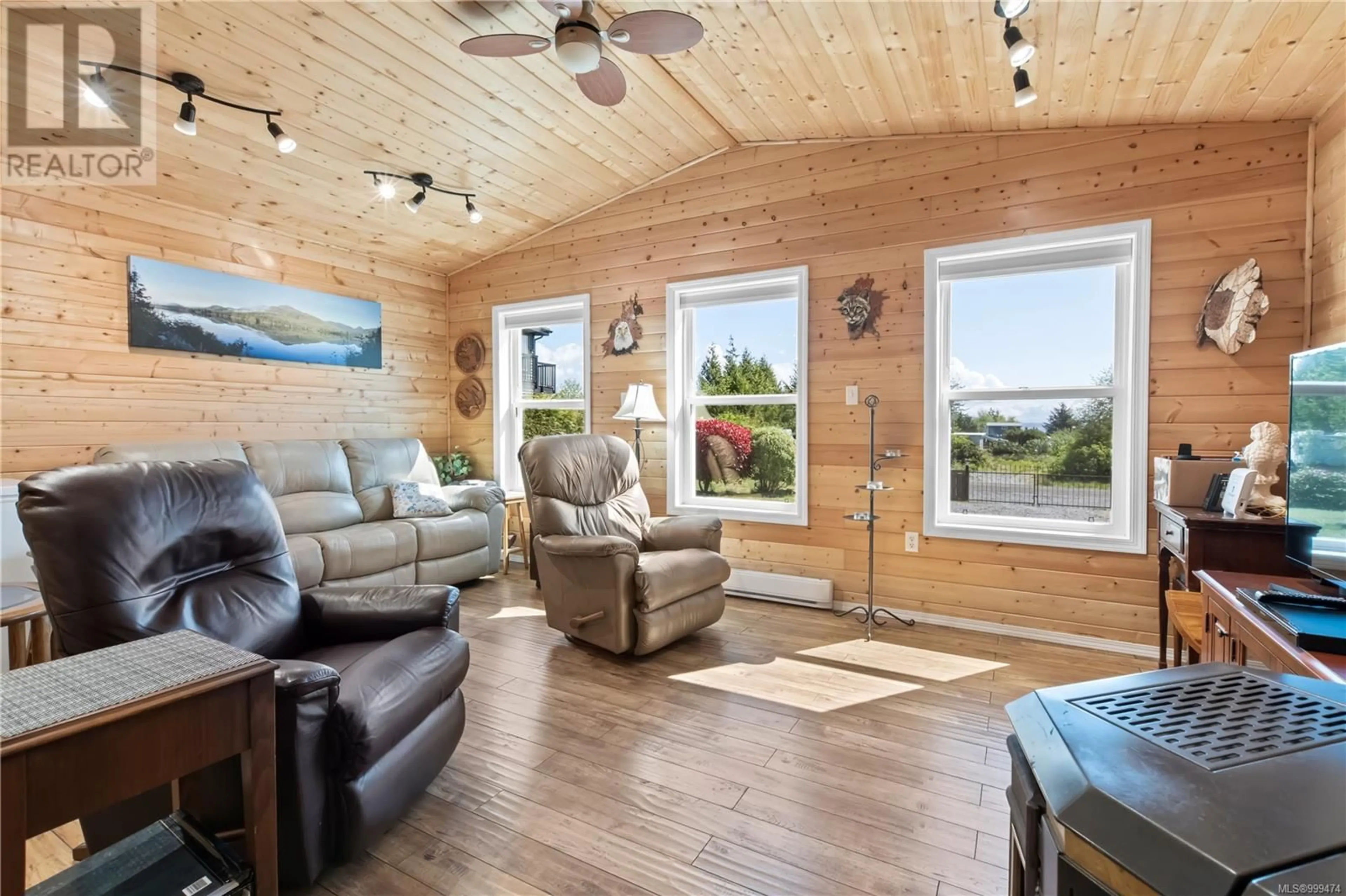 Living room with furniture, wood/laminate floor for 1065 SEVENTH AVENUE, Ucluelet British Columbia V0R3A0