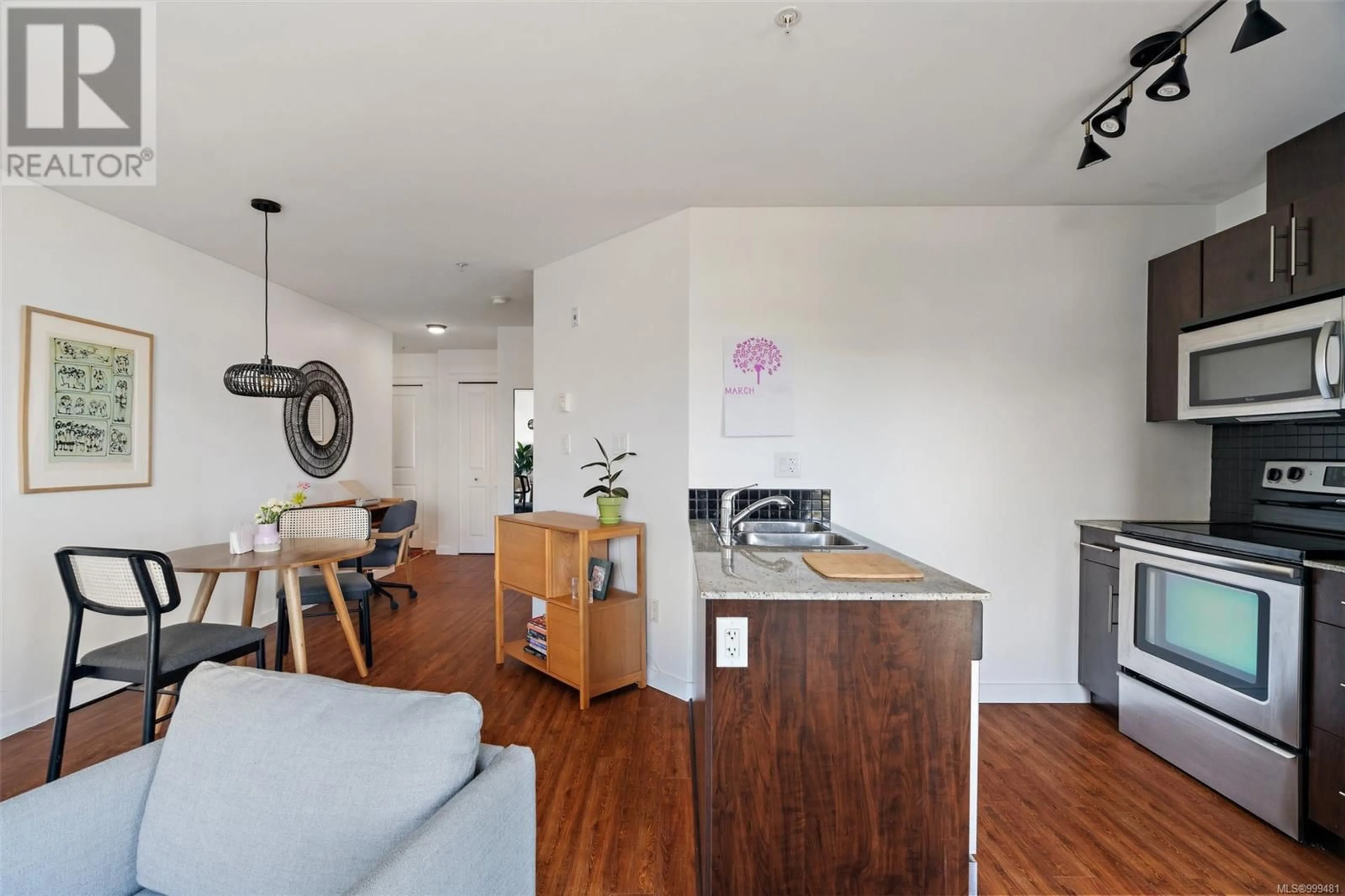 Open concept kitchen, wood/laminate floor for 414 - 1405 ESQUIMALT ROAD, Esquimalt British Columbia V9A0A4
