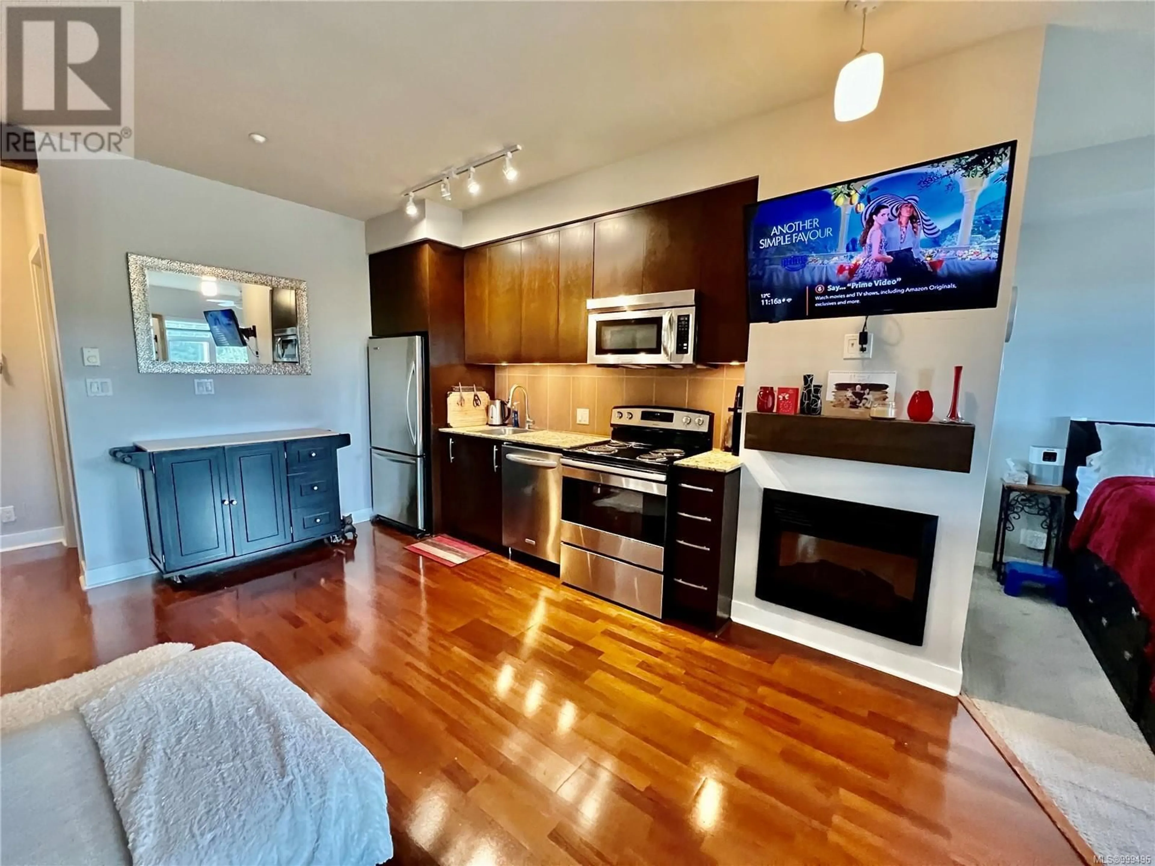 Open concept kitchen, wood/laminate floor for 219 - 1395 BEAR MOUNTAIN PARKWAY, Langford British Columbia V9B0E1