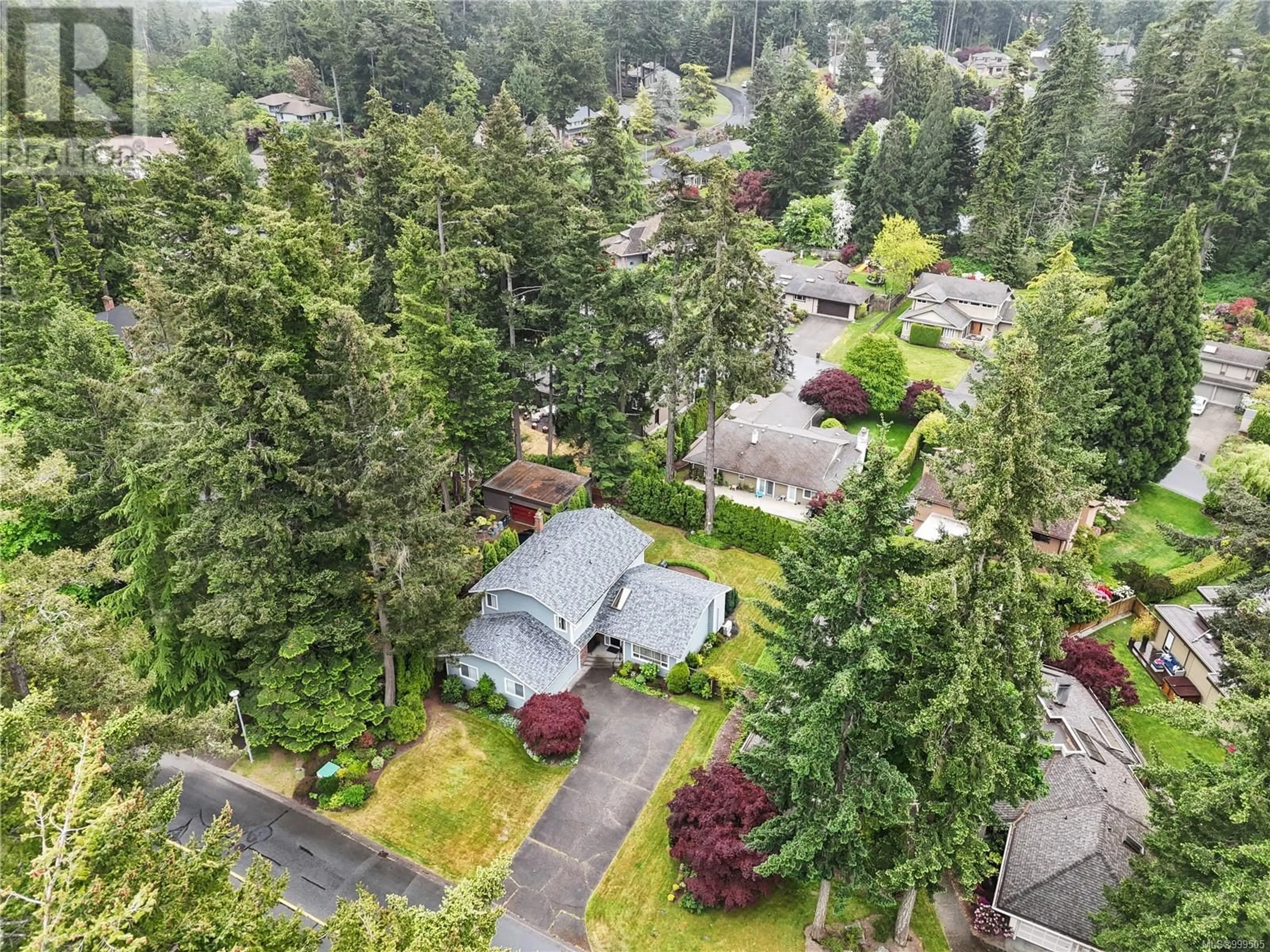 A pic from outside/outdoor area/front of a property/back of a property/a pic from drone, forest/trees view for 4431 EMILY CARR DRIVE, Saanich British Columbia V8X4M2