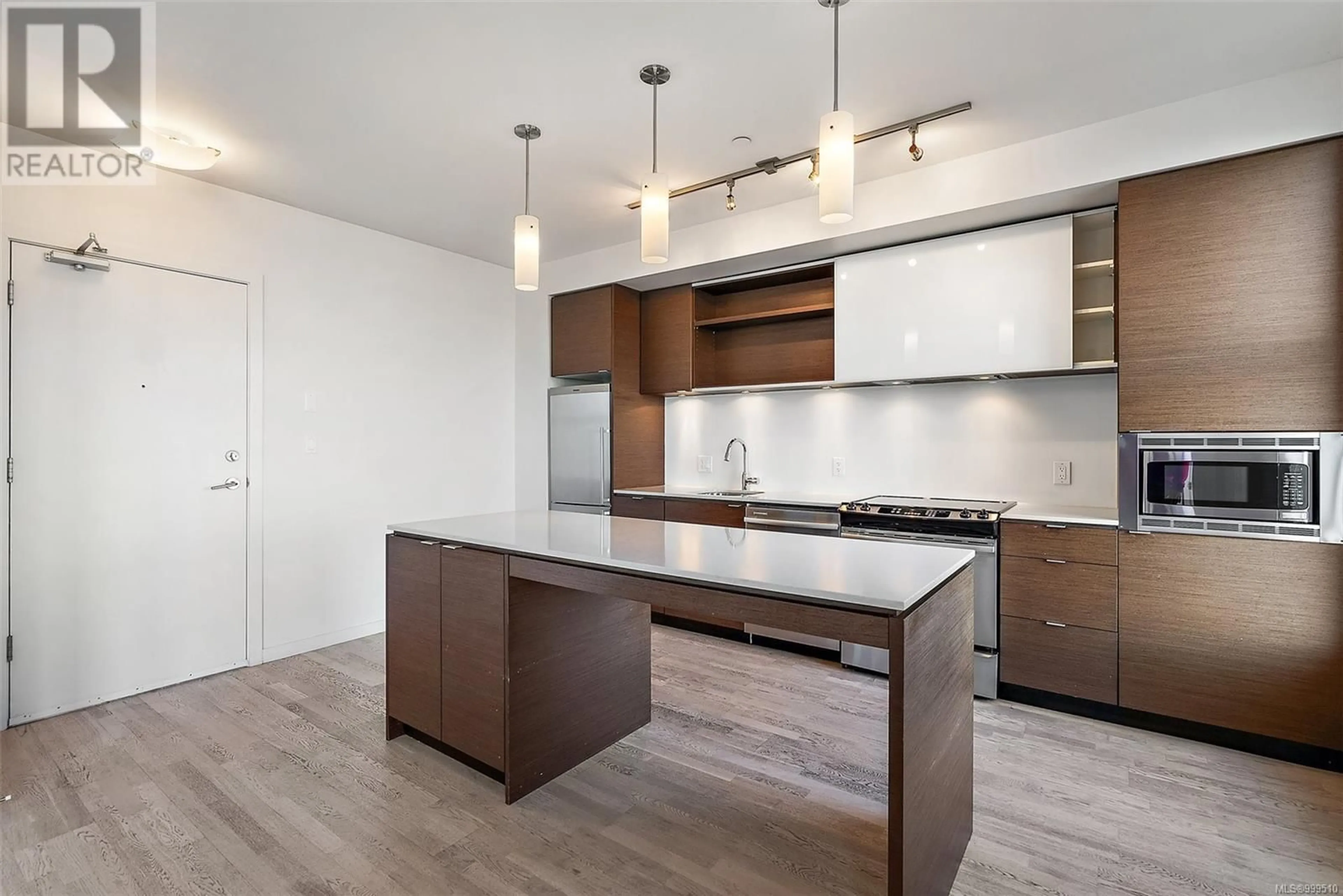 Open concept kitchen, wood/laminate floor for 201 - 601 HERALD STREET, Victoria British Columbia V8W1Z4