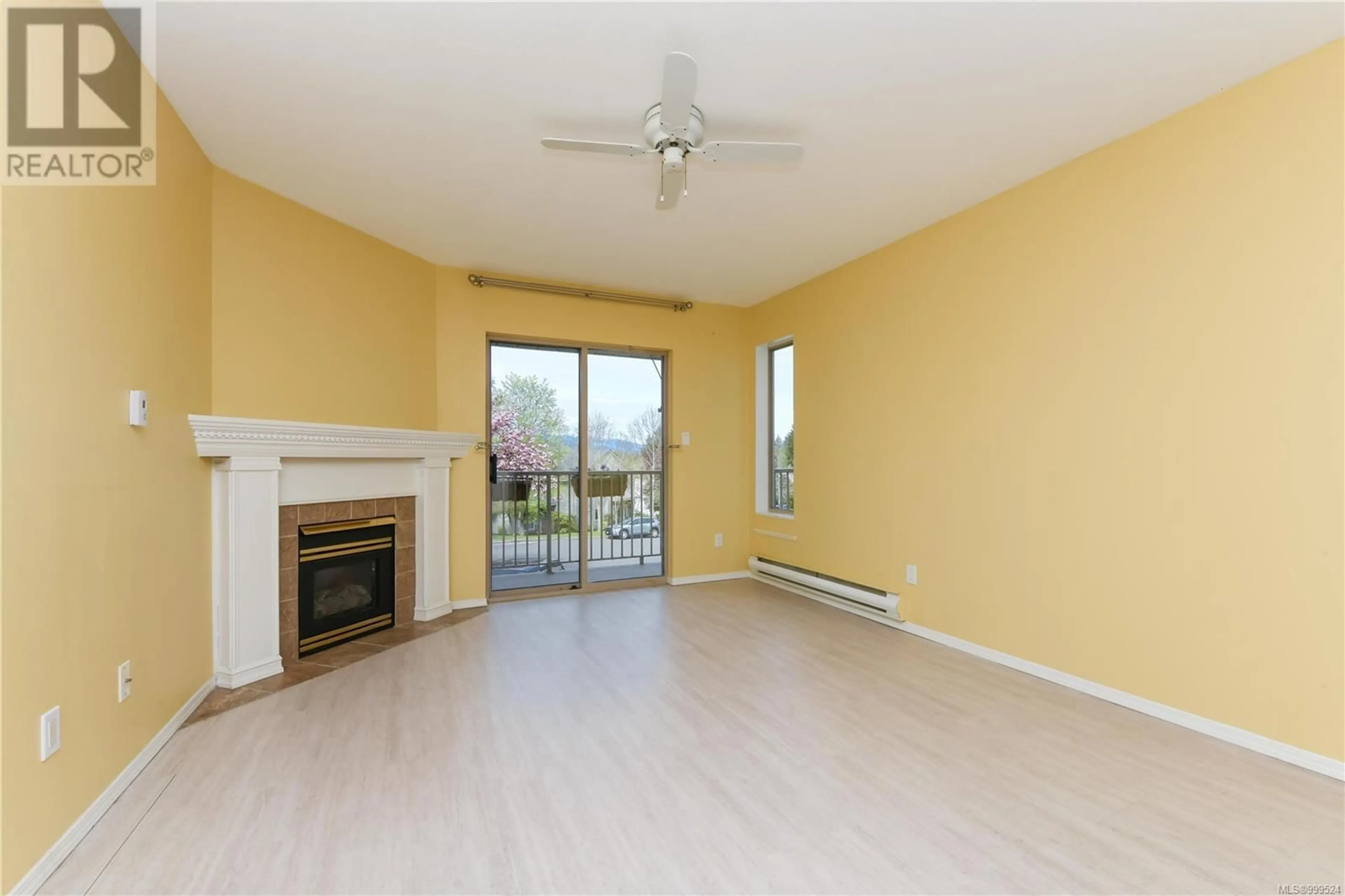 Living room with furniture, wood/laminate floor for 203 - 4686 ALDERWOOD PLACE, Courtenay British Columbia V9N9A1