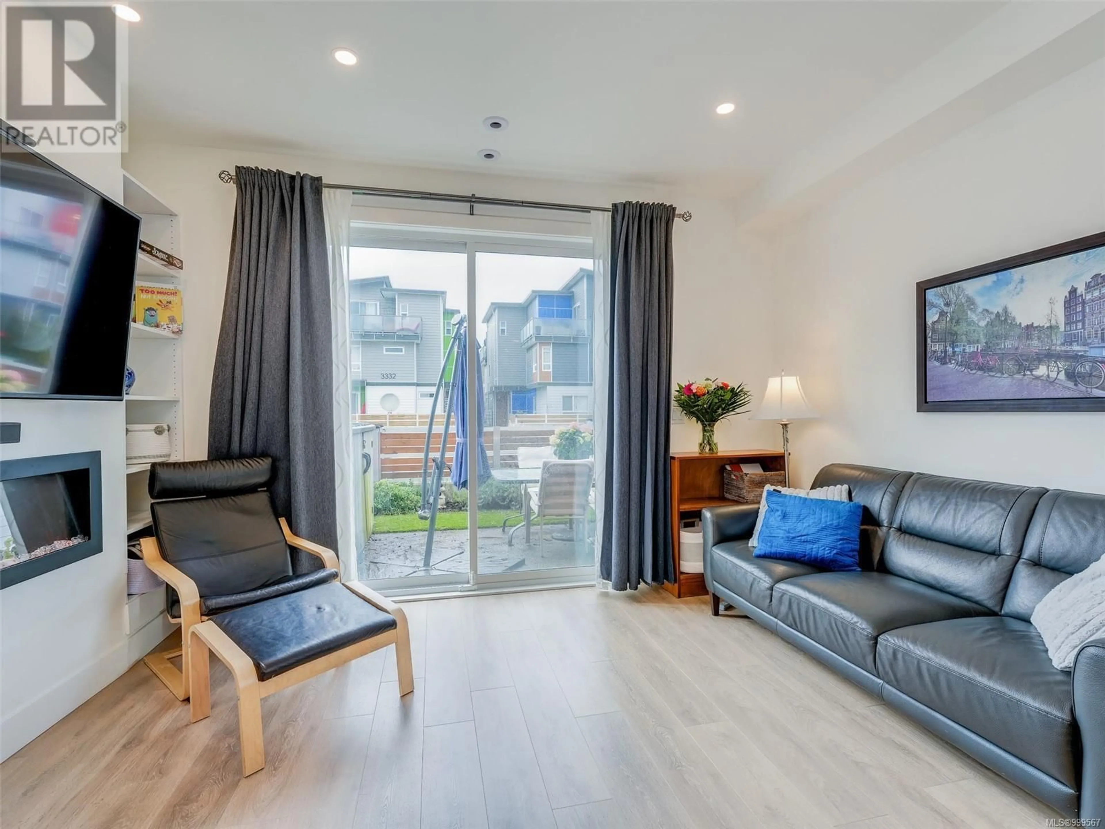Living room with furniture, wood/laminate floor for 101 - 3331 RADIANT WAY, Langford British Columbia V9C0K3