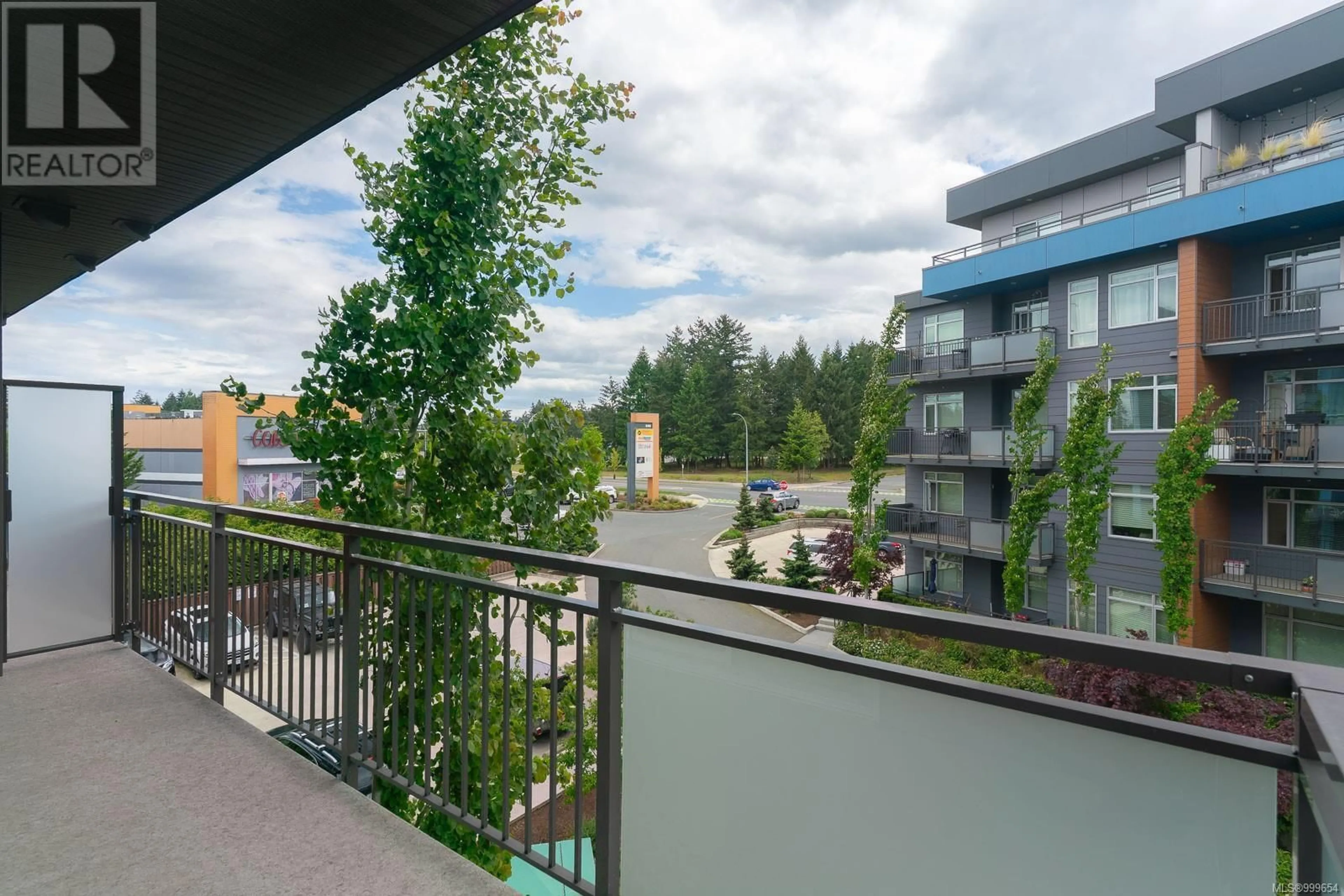 Balcony in the apartment, city buildings view from balcony for 306 - 6544 METRAL DRIVE, Nanaimo British Columbia V9T2L8