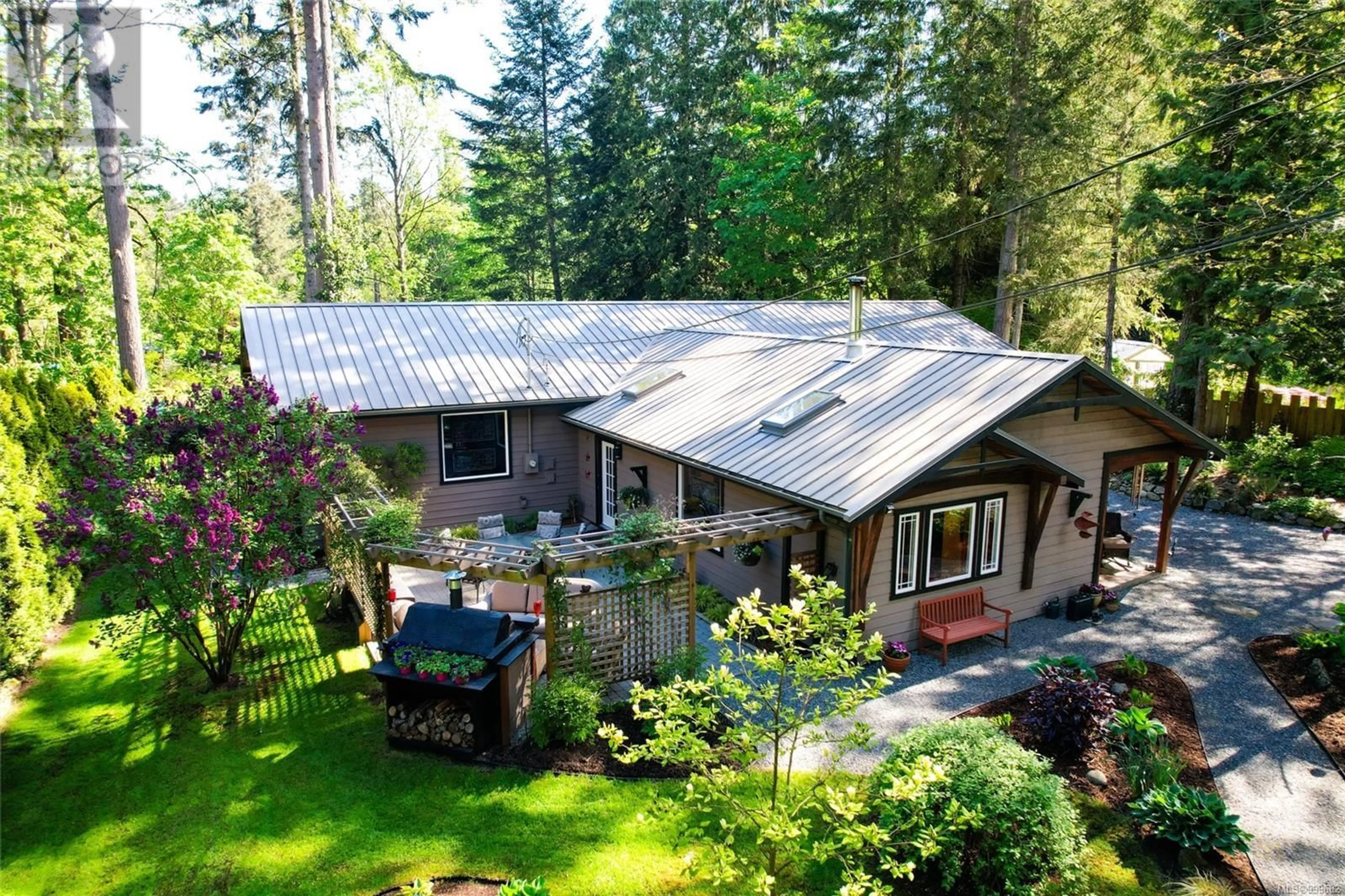 A pic from outside/outdoor area/front of a property/back of a property/a pic from drone, forest/trees view for 1126 NORTH ROAD, Gabriola Island British Columbia V0R1X3