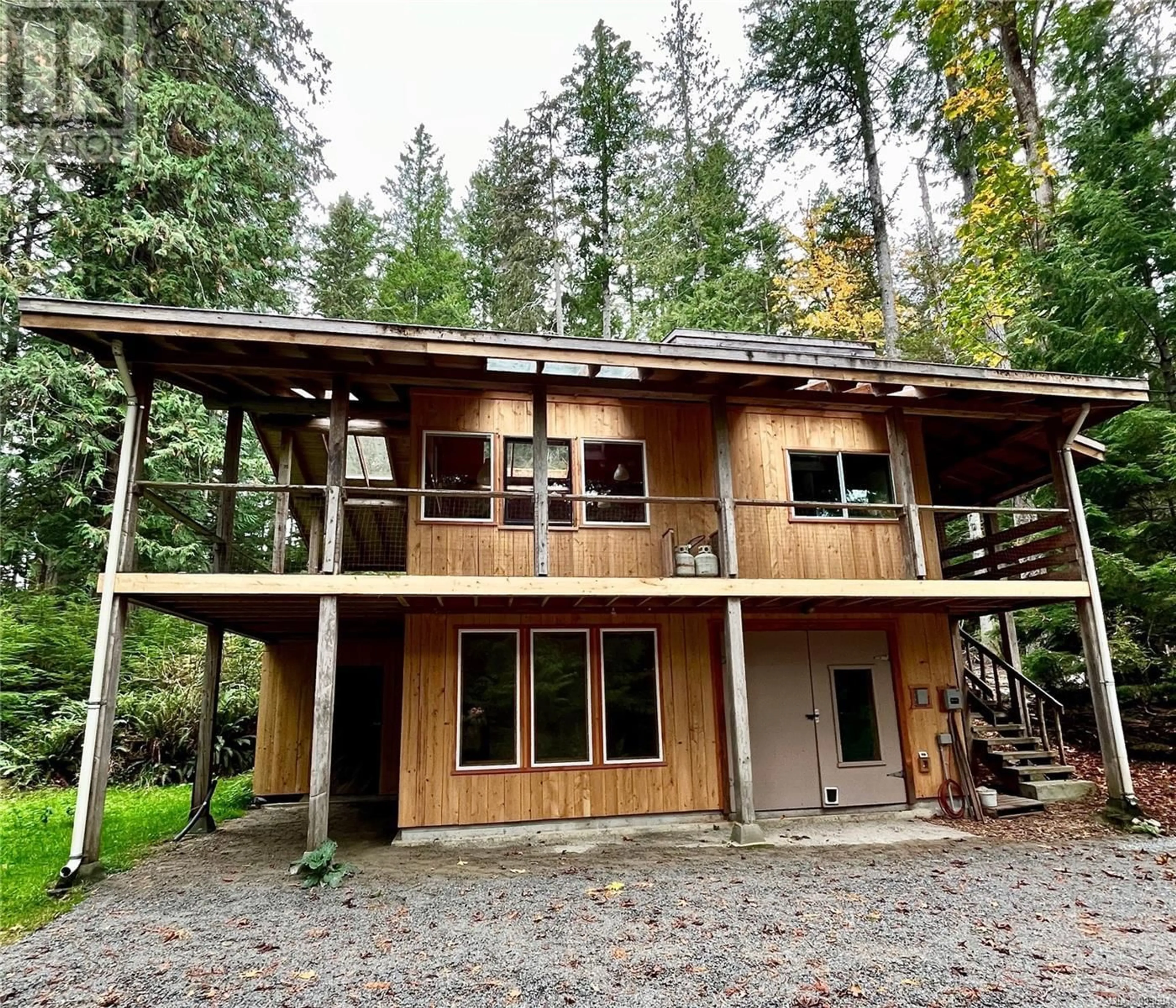 Home with vinyl exterior material, forest/trees view for 421 WHALETOWN ROAD, Cortes Island British Columbia V0P1Z0