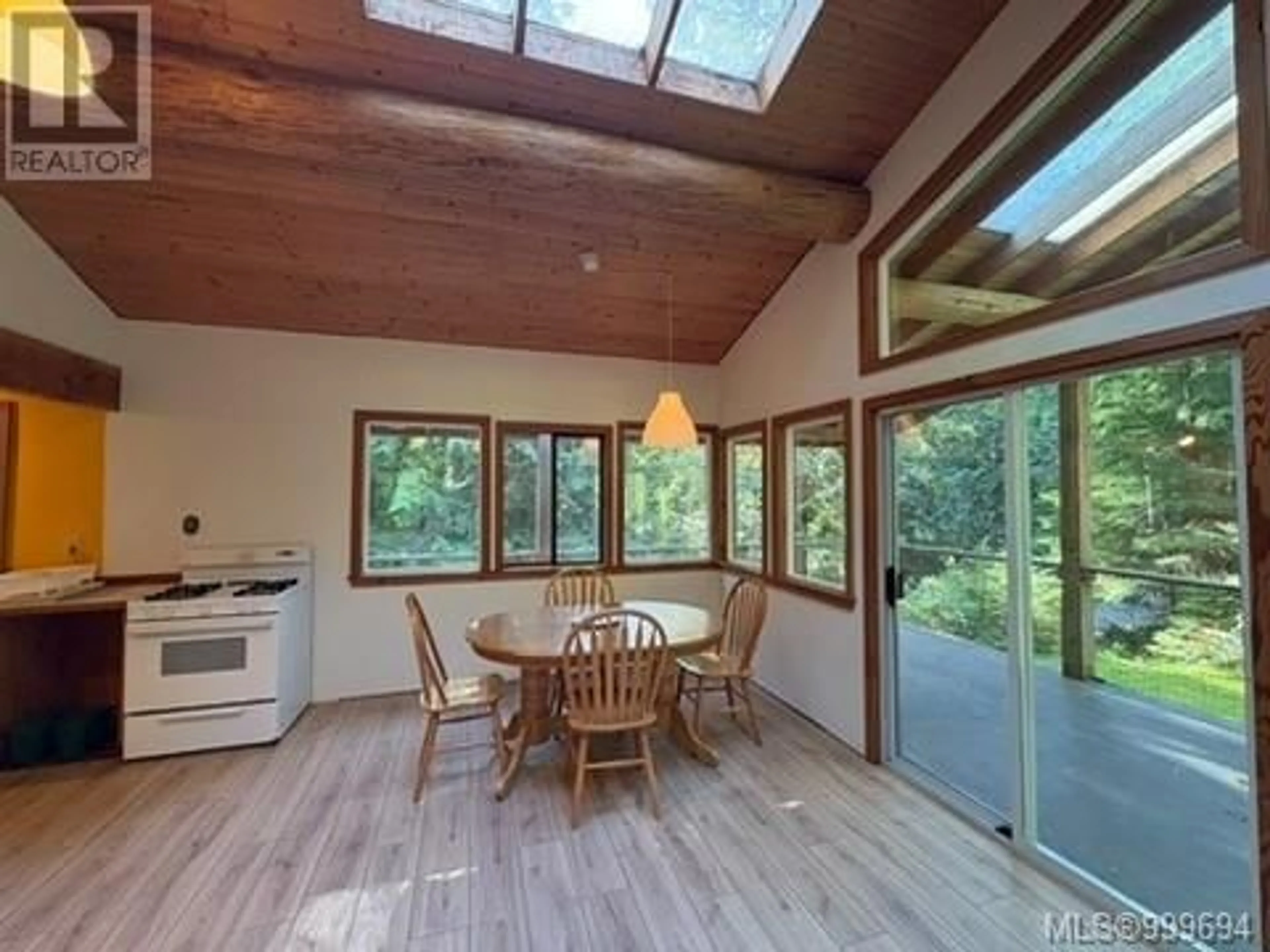 Dining room, wood/laminate floor for 421 WHALETOWN ROAD, Cortes Island British Columbia V0P1Z0