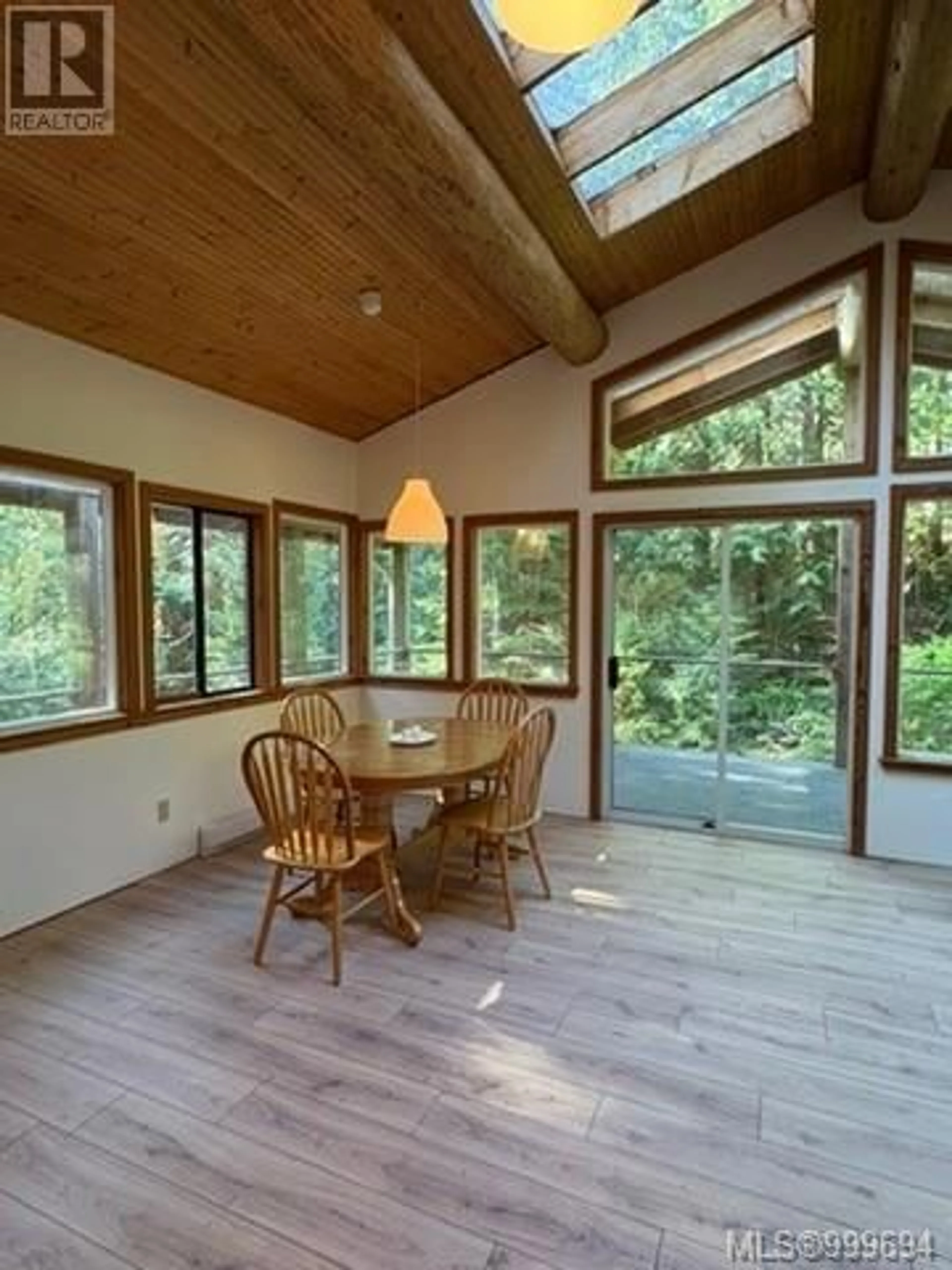 Dining room, wood/laminate floor for 421 WHALETOWN ROAD, Cortes Island British Columbia V0P1Z0