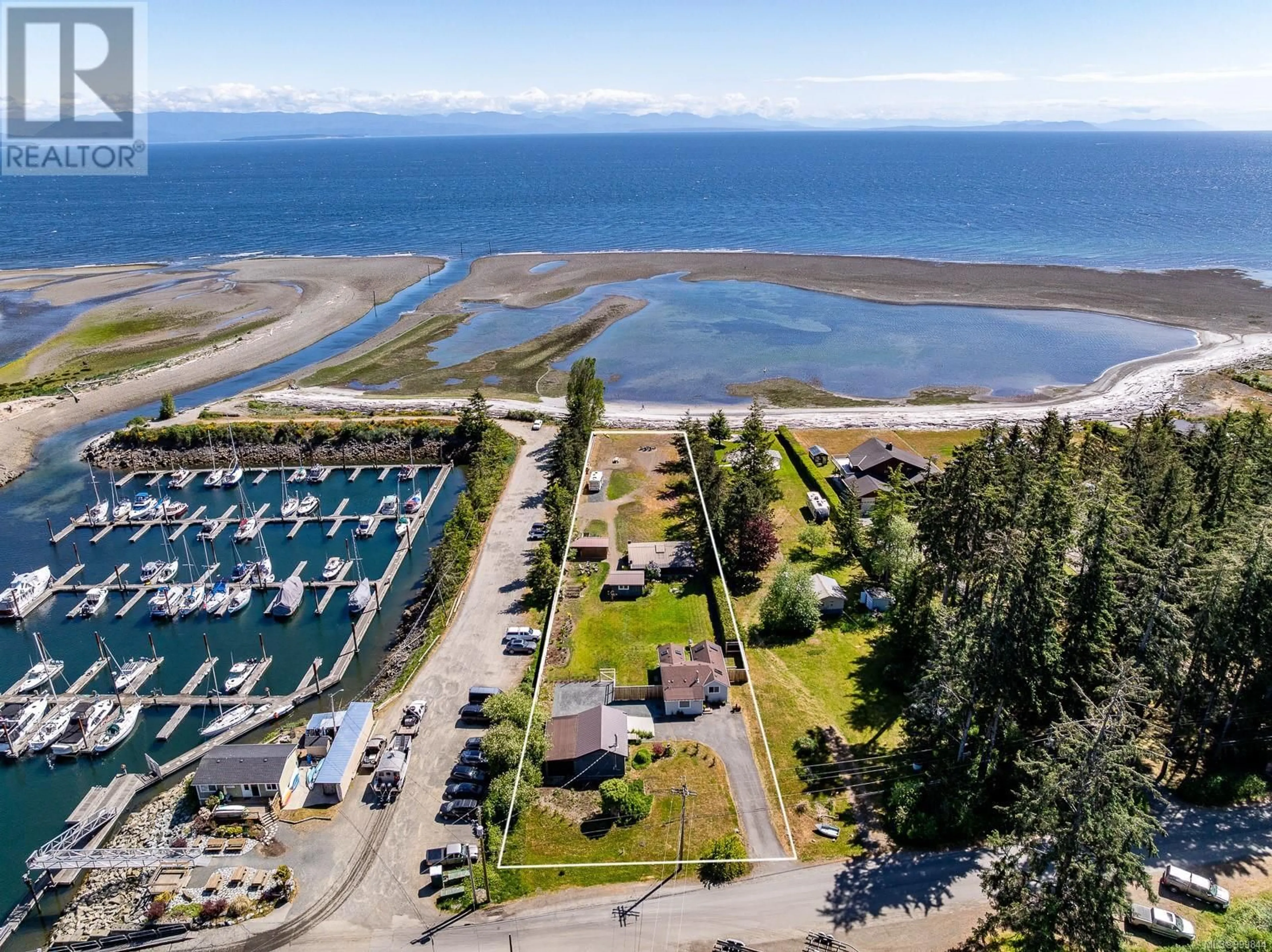 A pic from outside/outdoor area/front of a property/back of a property/a pic from drone, water/lake/river/ocean view for 9074 CLARKSON AVENUE, Black Creek British Columbia V9J1B3