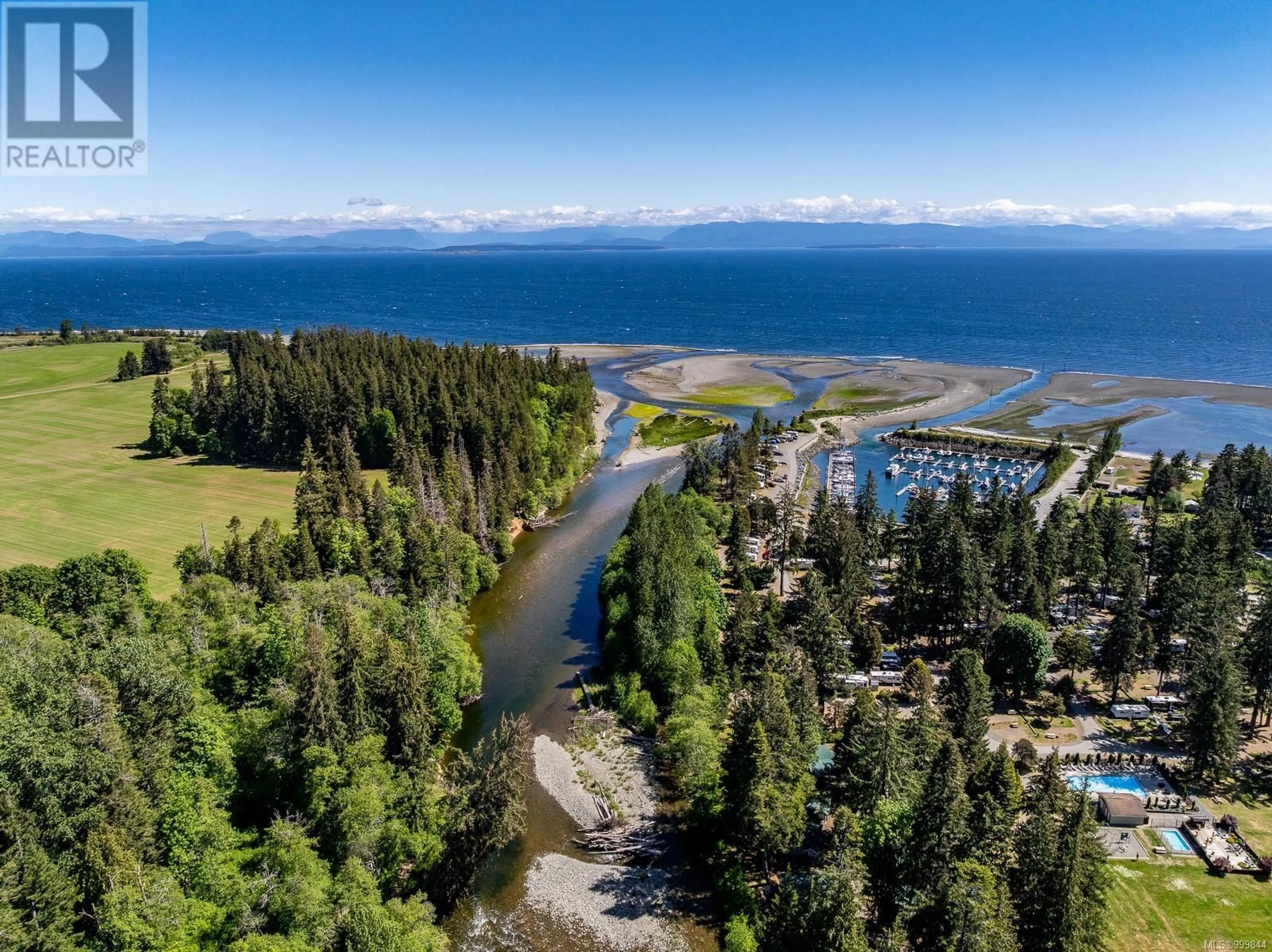 A pic from outside/outdoor area/front of a property/back of a property/a pic from drone, water/lake/river/ocean view for 9074 CLARKSON AVENUE, Black Creek British Columbia V9J1B3