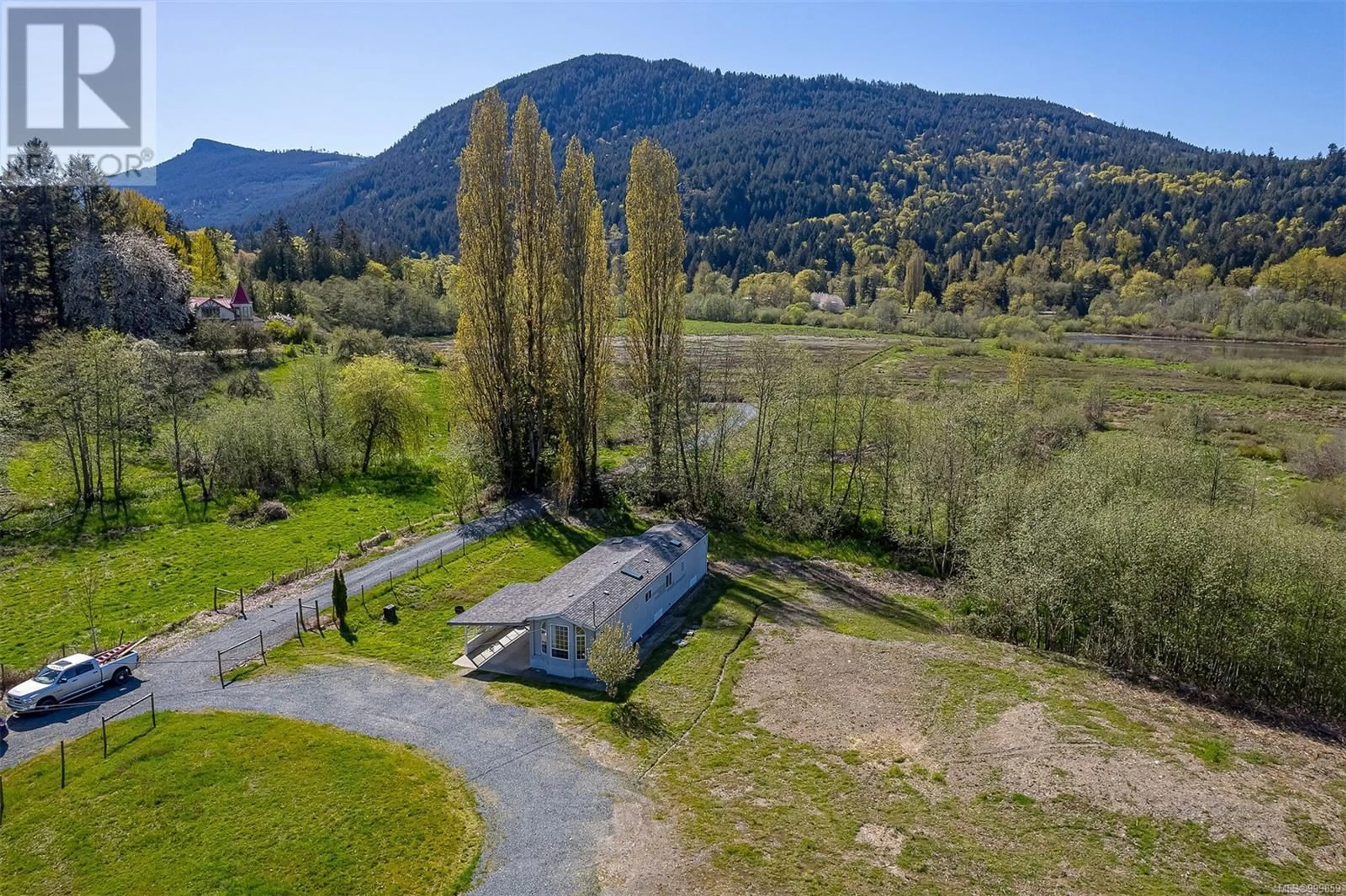 A pic from outside/outdoor area/front of a property/back of a property/a pic from drone, mountain view for 7600 WESTHOLME ROAD, Duncan British Columbia V9L6B4