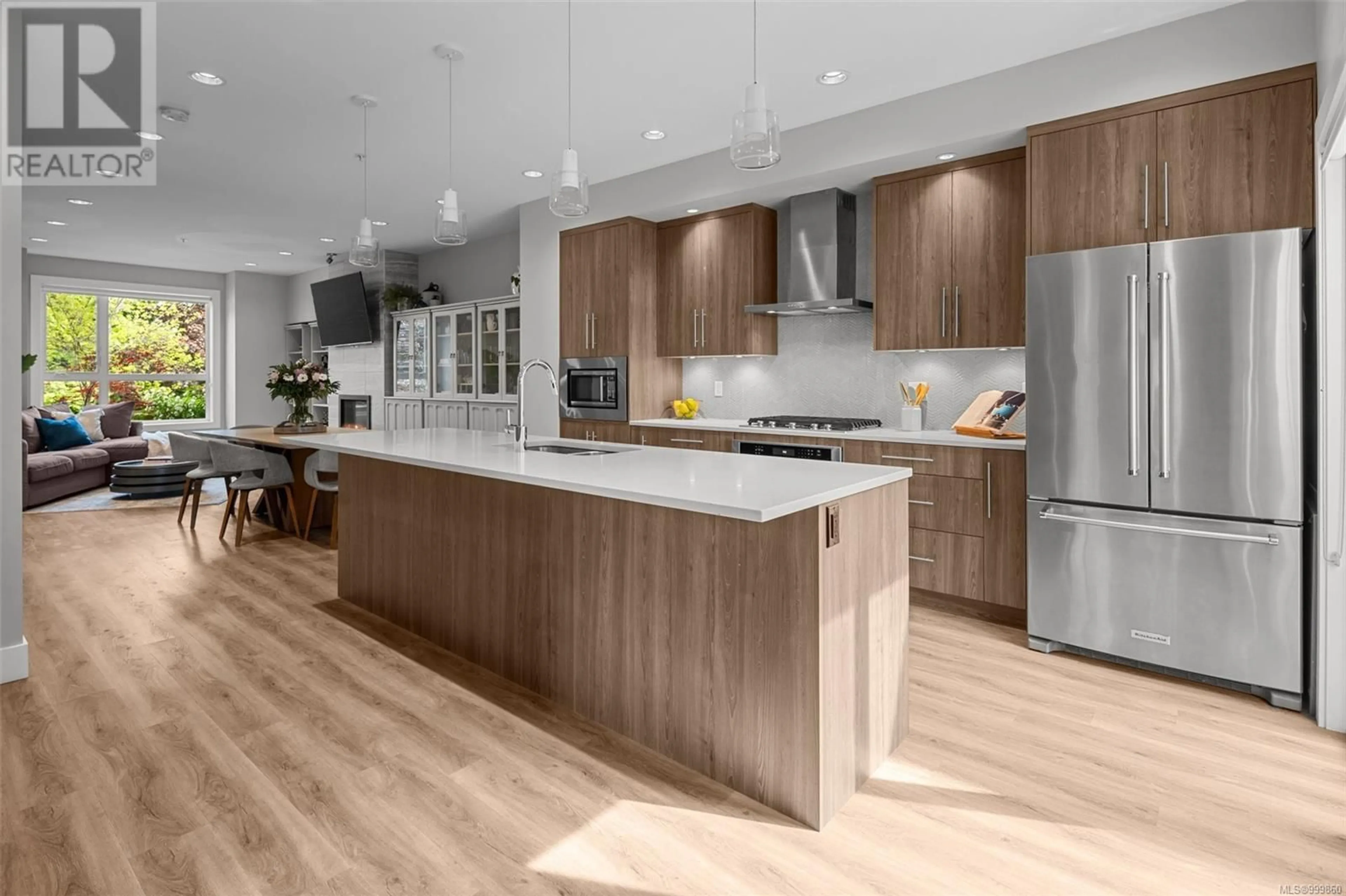 Open concept kitchen, wood/laminate floor for 7884 LOCHSIDE DRIVE, Central Saanich British Columbia V8M2B9