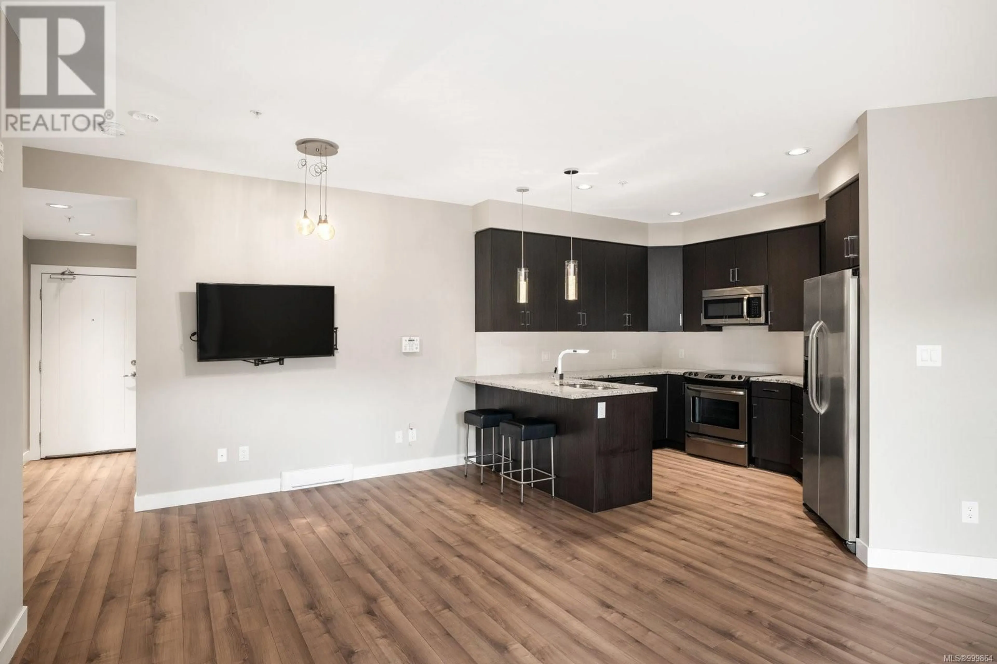 Open concept kitchen, wood/laminate floor for 209 - 2655 SOOKE ROAD, Langford British Columbia V9C3N8