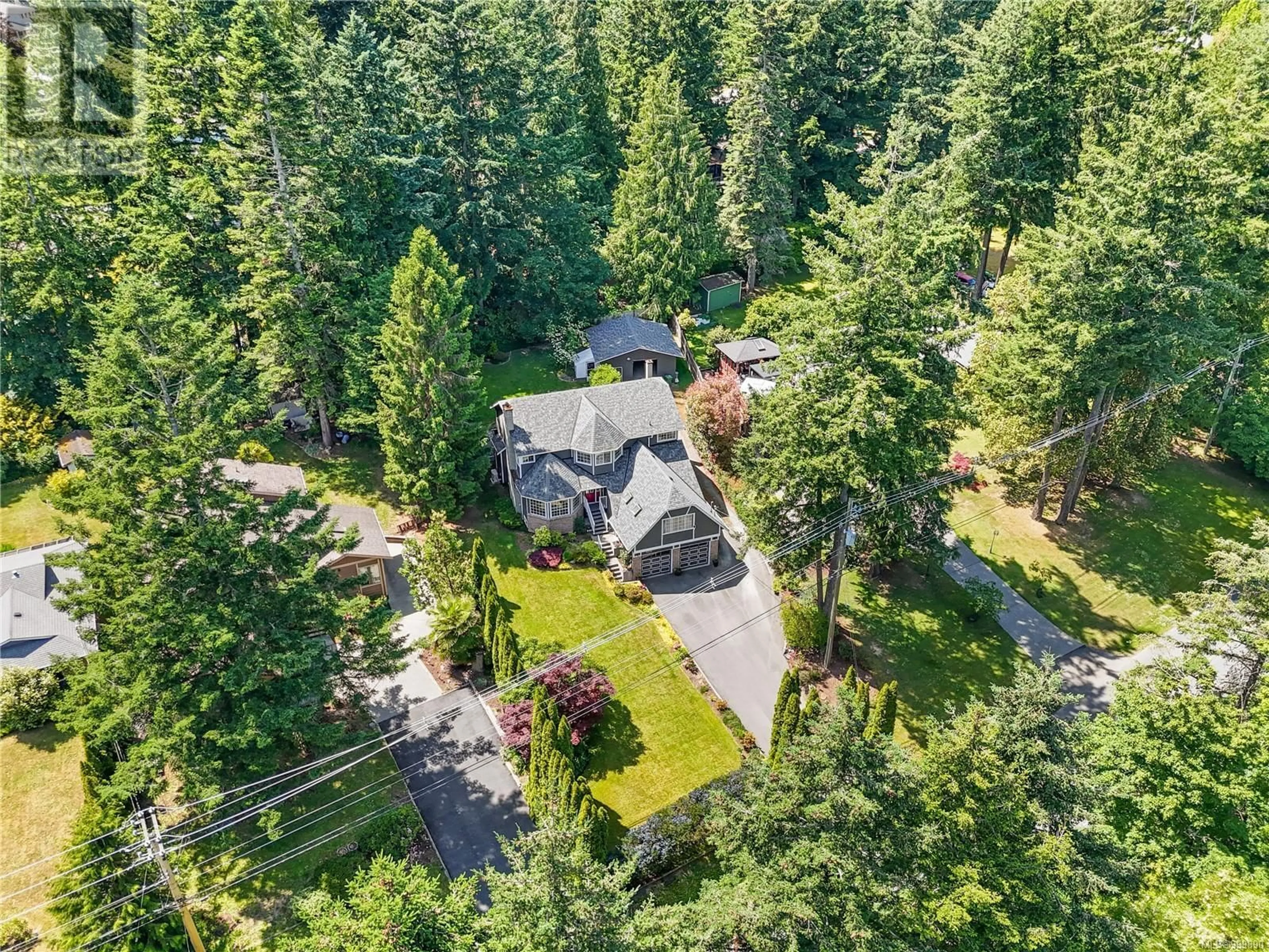 A pic from outside/outdoor area/front of a property/back of a property/a pic from drone, forest/trees view for 7324 VEYANESS ROAD, Central Saanich British Columbia V8M1S9