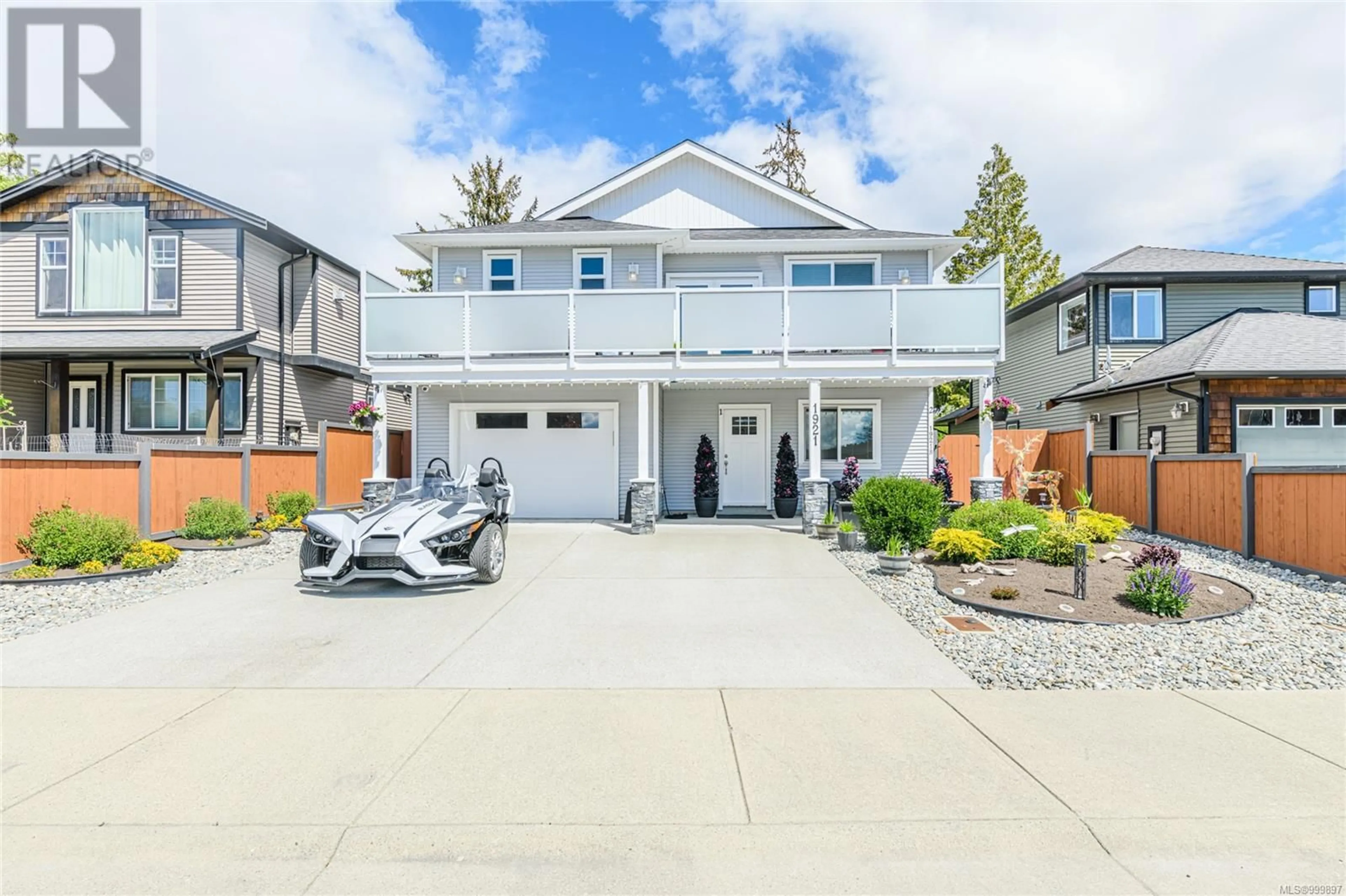 Home with vinyl exterior material, street for 1921 TOMINNY ROAD, Sooke British Columbia V9Z0P8
