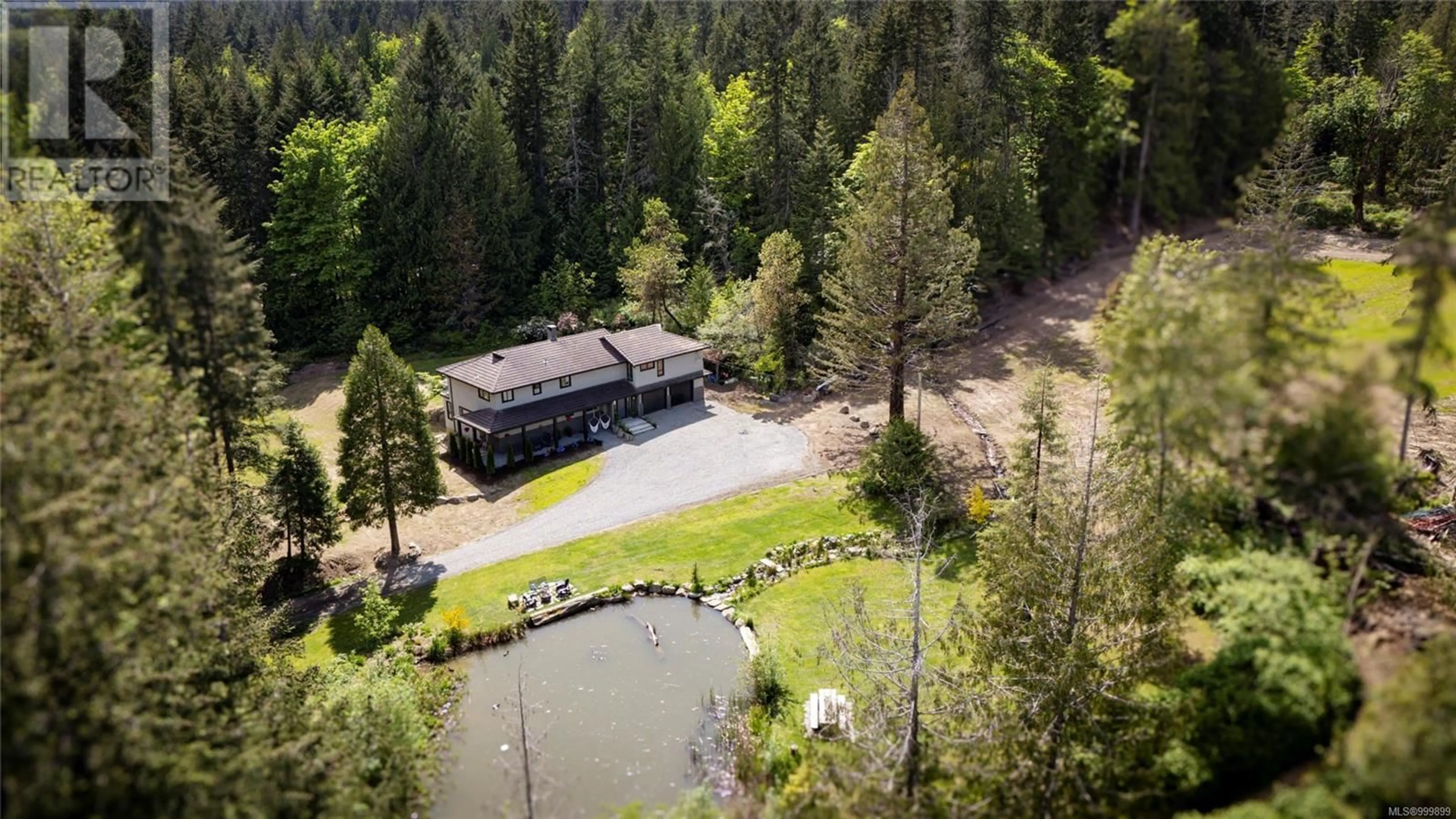A pic from outside/outdoor area/front of a property/back of a property/a pic from drone, unknown for 6866 DOUMONT ROAD, Nanaimo British Columbia V9T6G9