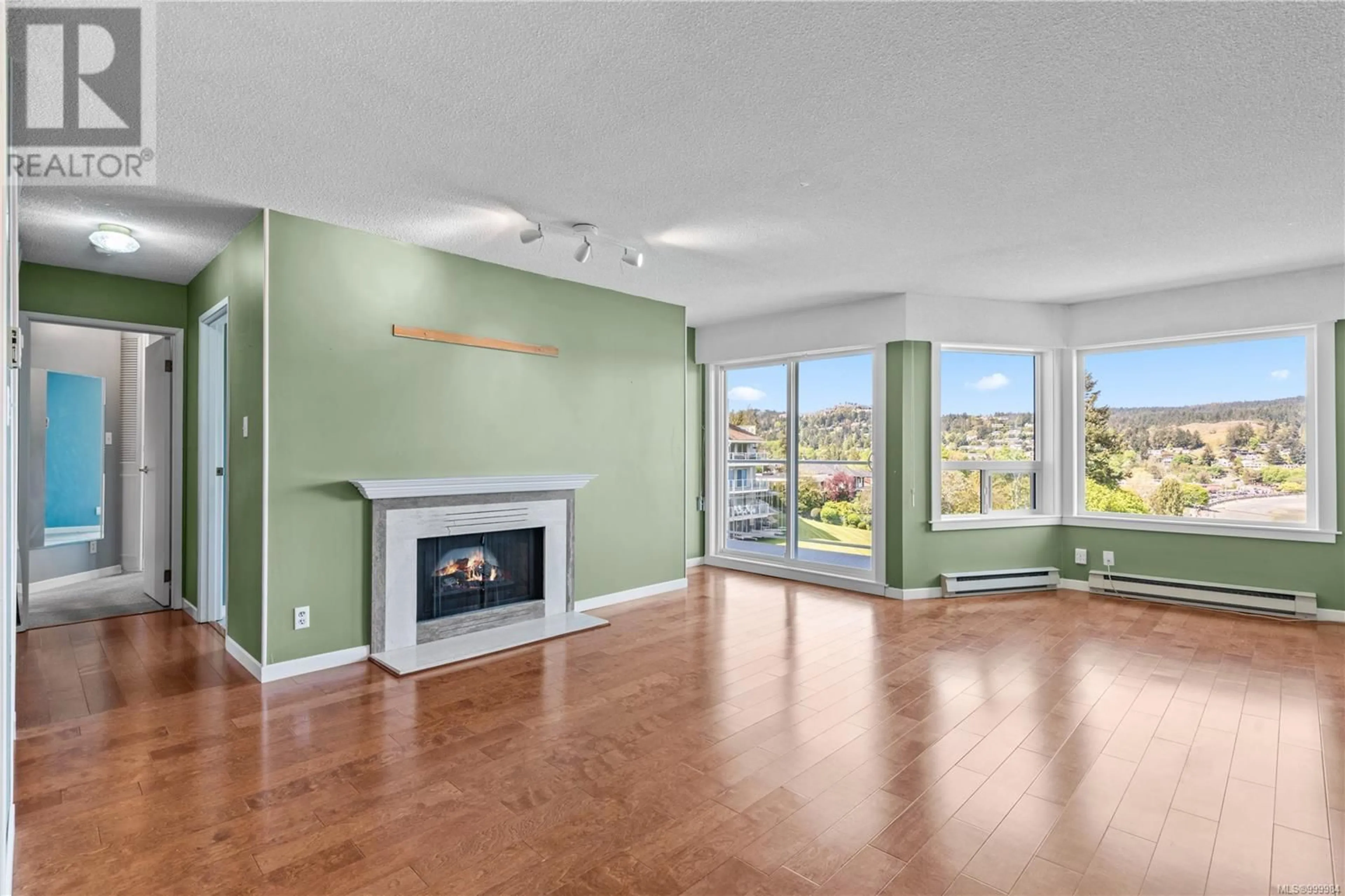 Living room with furniture, wood/laminate floor for 405 - 2560 DEPARTURE BAY ROAD, Nanaimo British Columbia V9S5P1