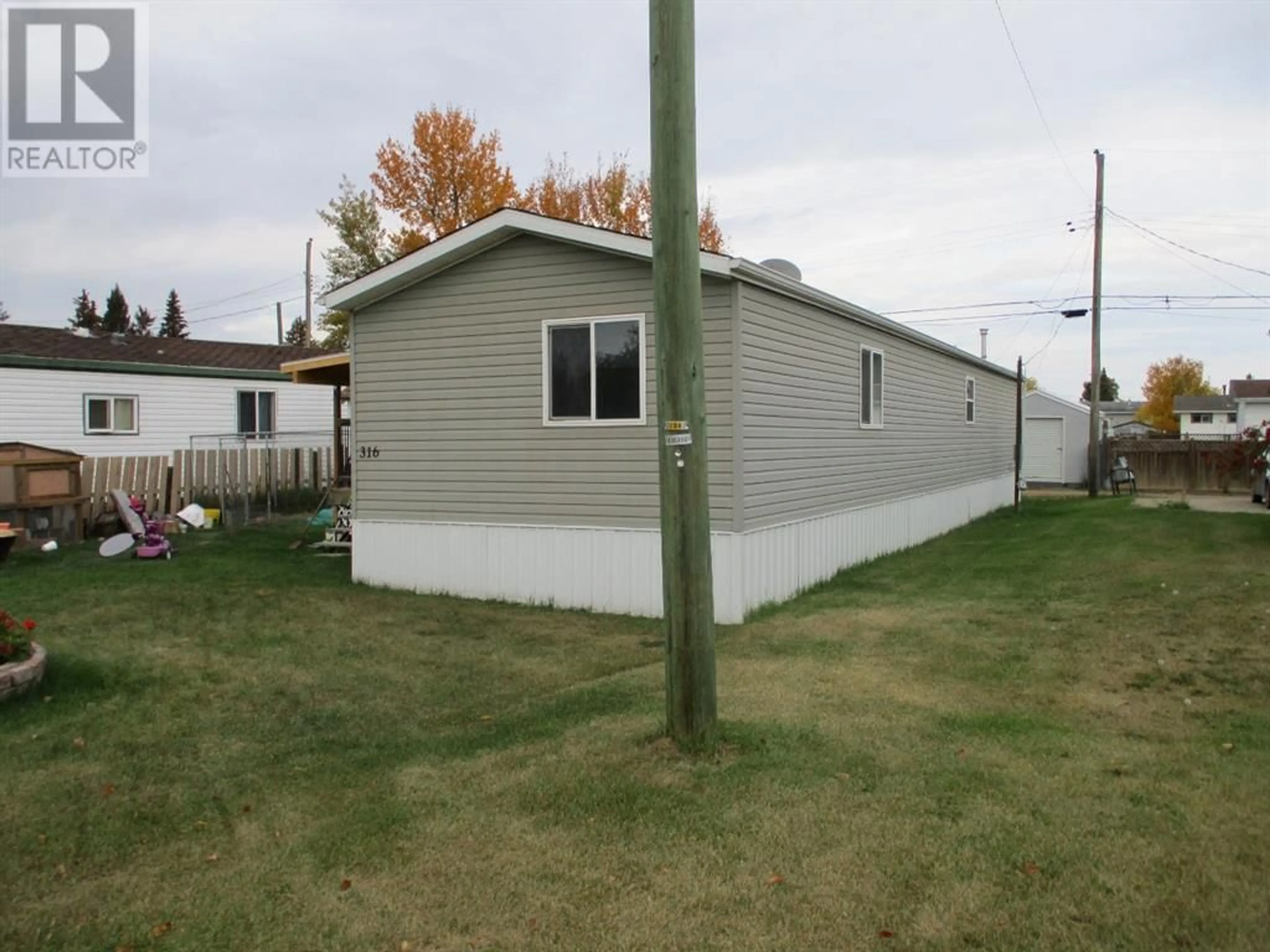Frontside or backside of a home for 316 8th Ave  SE, Manning Alberta T0H2M0