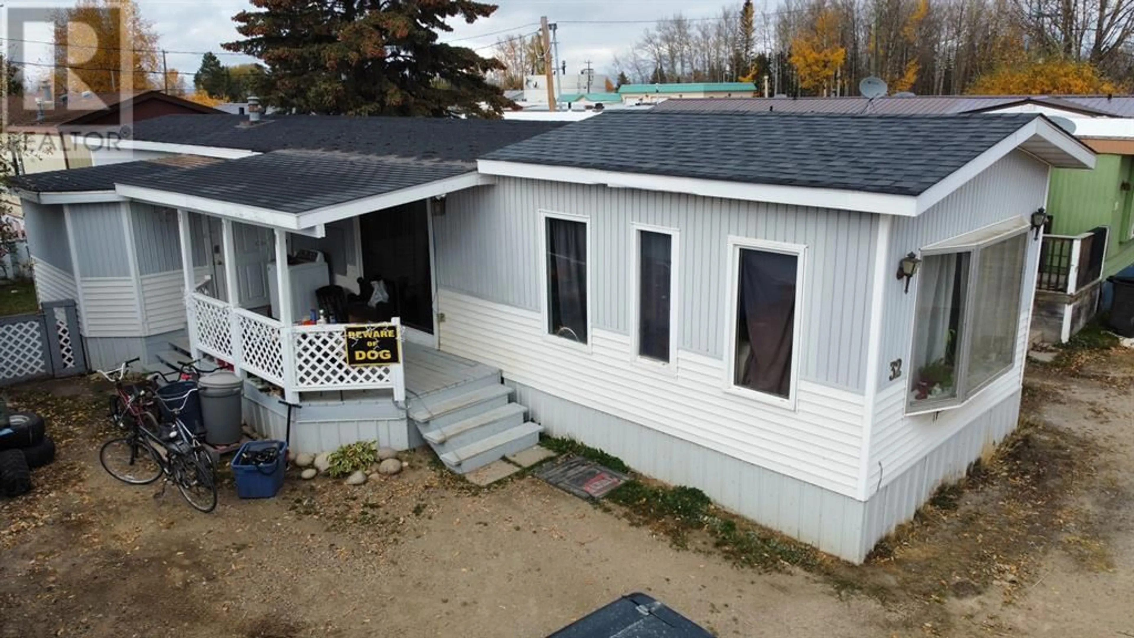 Home with vinyl exterior material for 32 Kaybob Mobile home park, Fox Creek Alberta T0H1P0