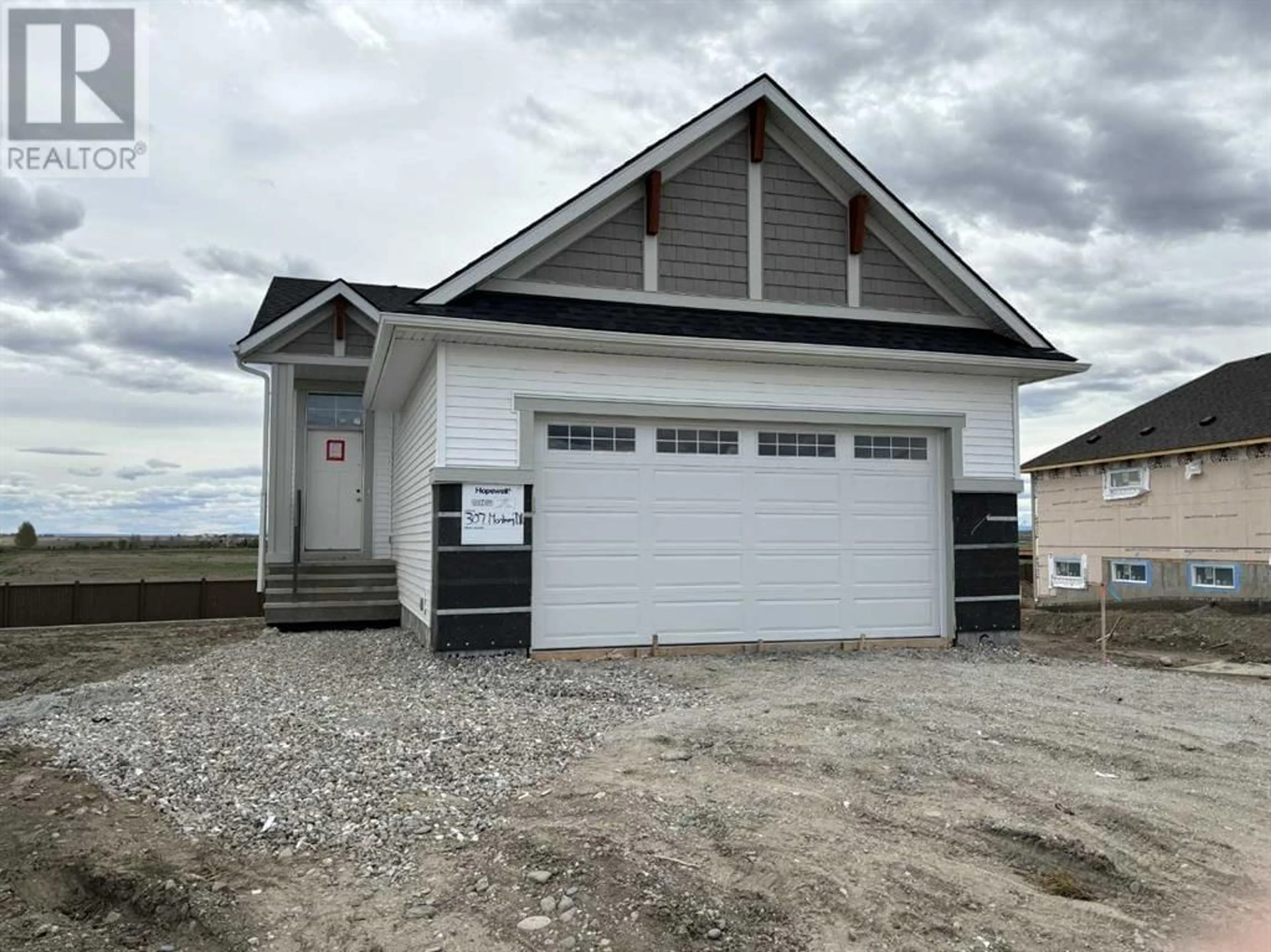 Frontside or backside of a home for 307 Monterey Drive SE, High River Alberta T1V0J7