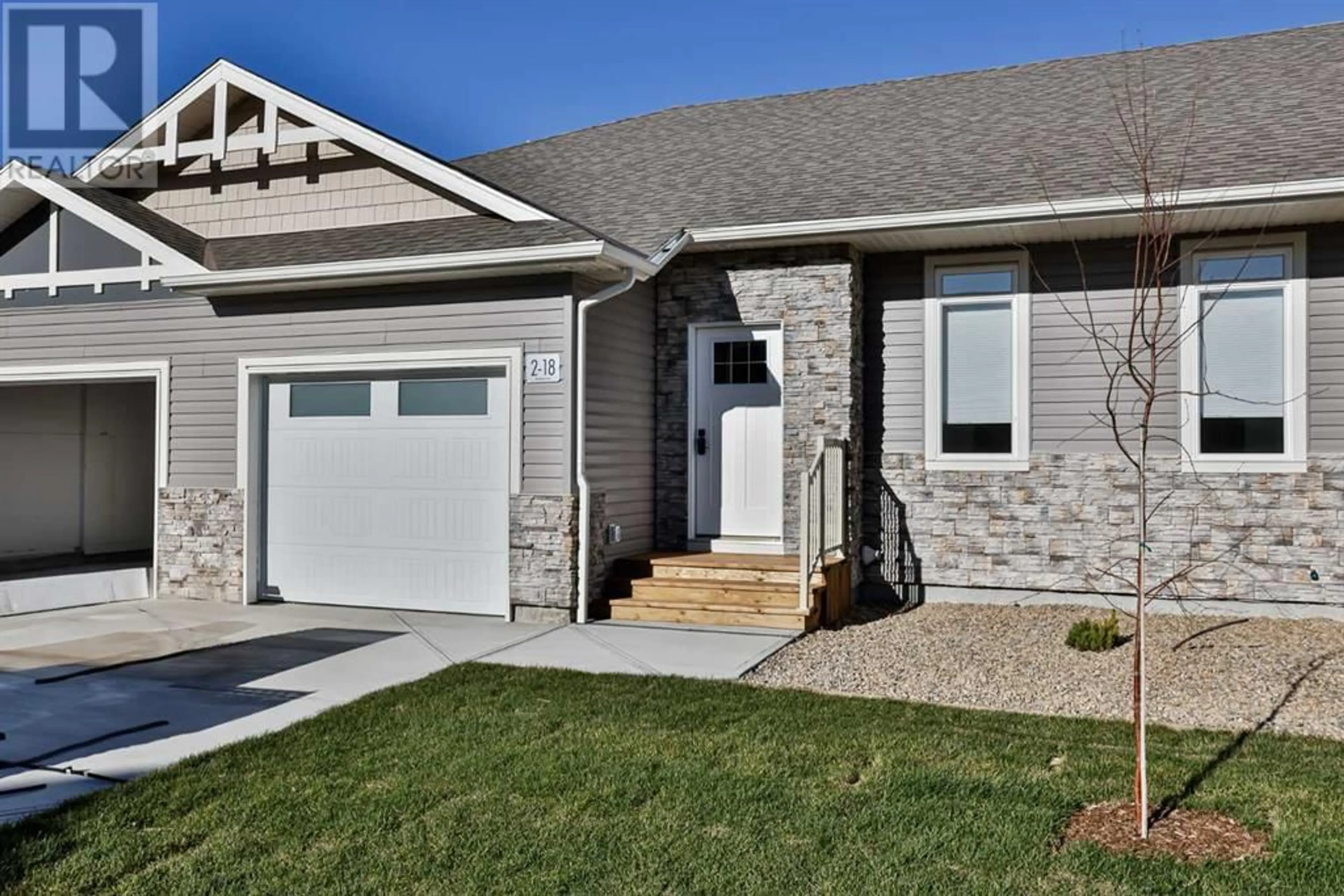 Home with vinyl exterior material for 2 18 Riverford Close W, Lethbridge Alberta T1K8K8