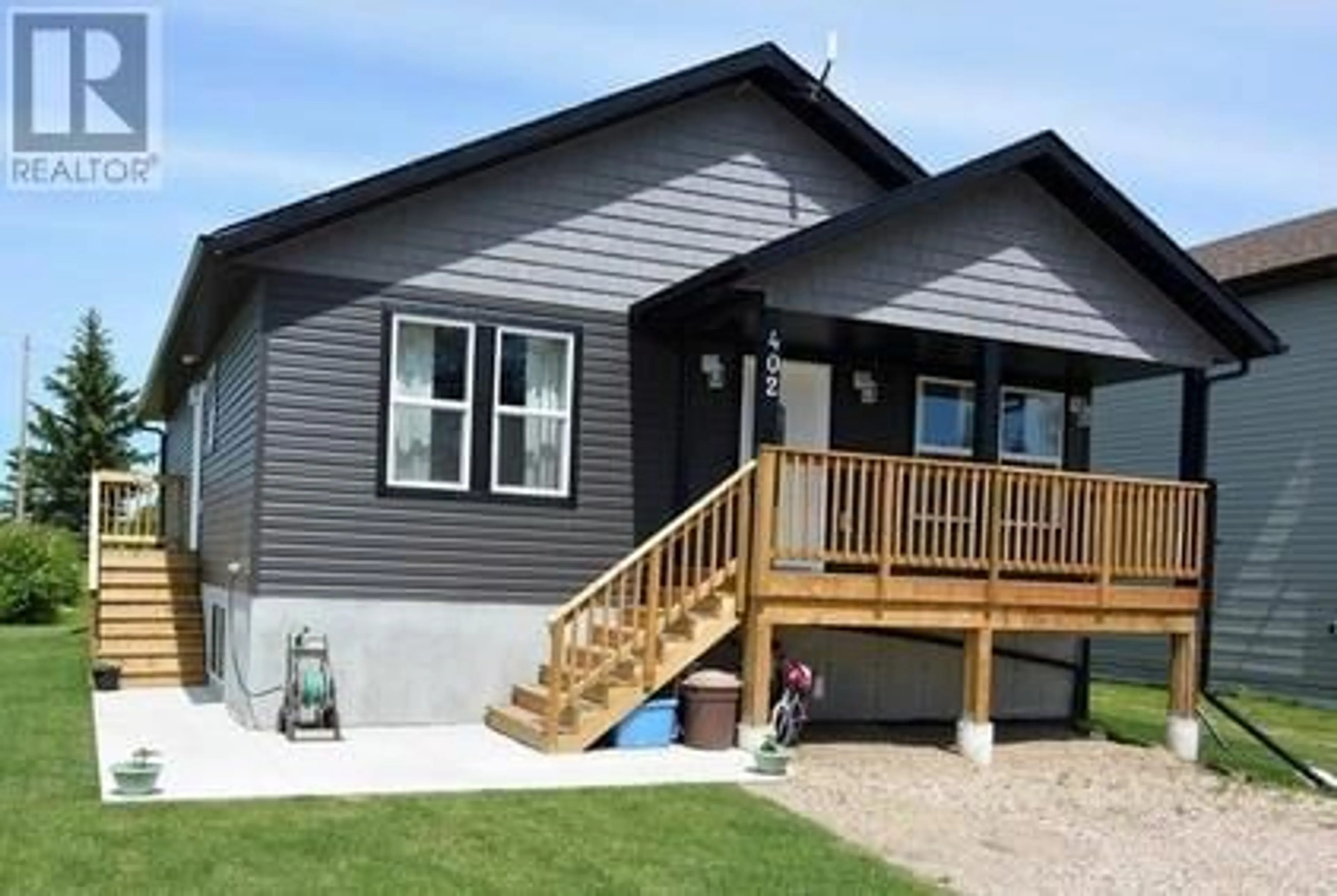 Home with vinyl exterior material for 402 4th Avenue, Elnora Alberta T0M0Y0