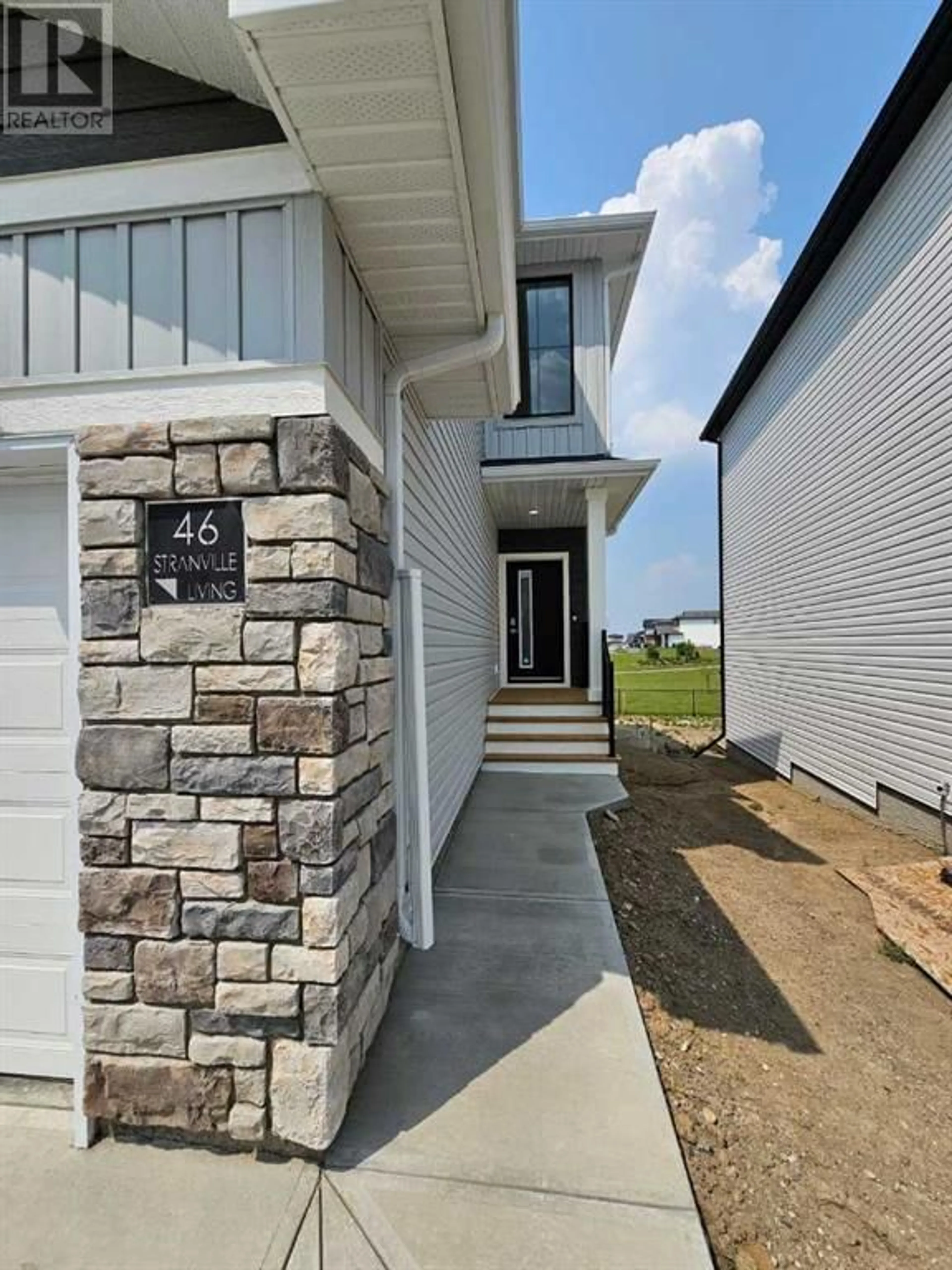 Home with brick exterior material for 46 Blackwolf Pass N, Lethbridge Alberta T1H7H7