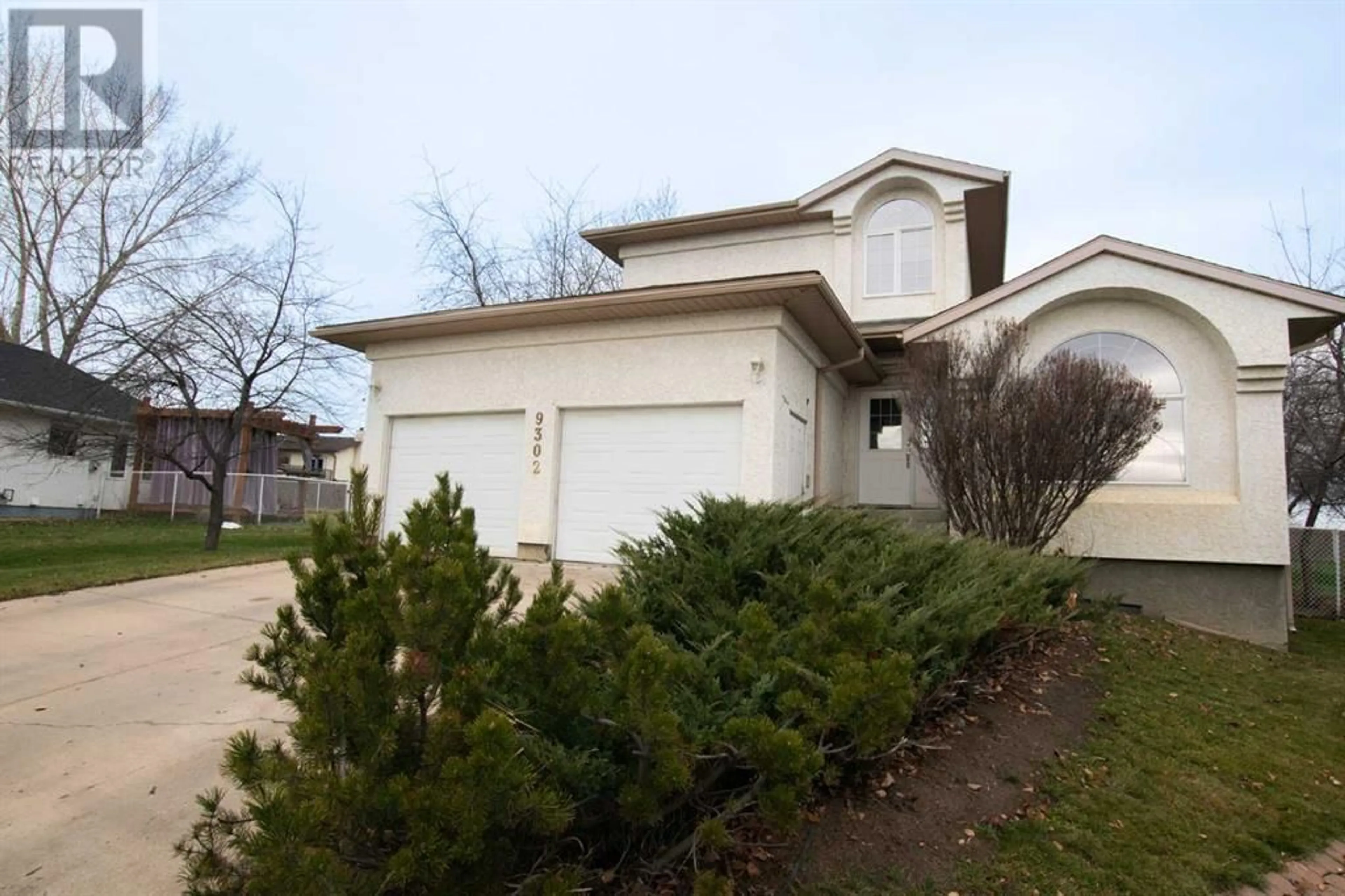 Frontside or backside of a home for 9302 62 Avenue, Grande Prairie Alberta T8W2E6