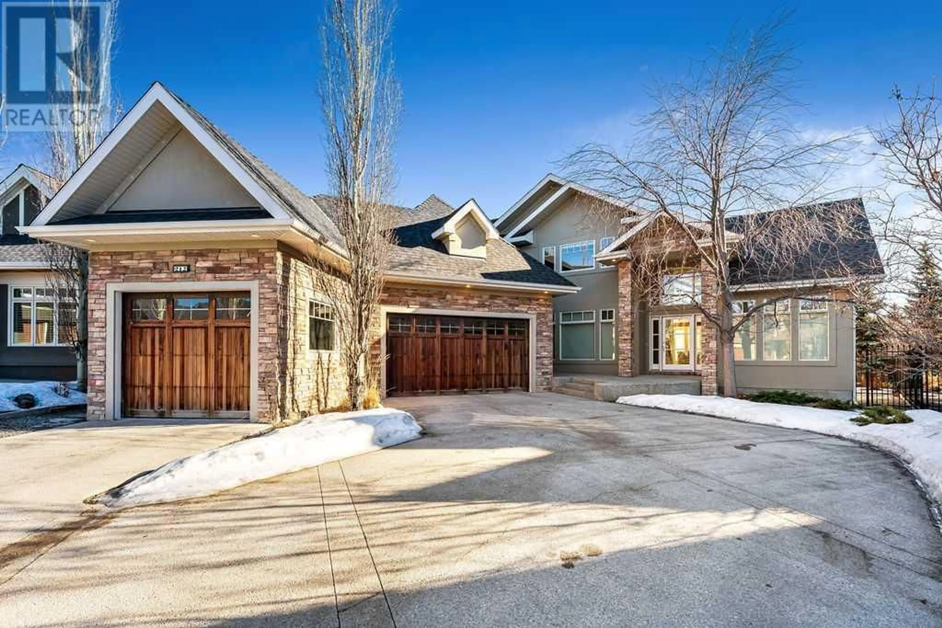 Home with brick exterior material for 212 Aspen Meadows Court SW, Calgary Alberta T3H4T3