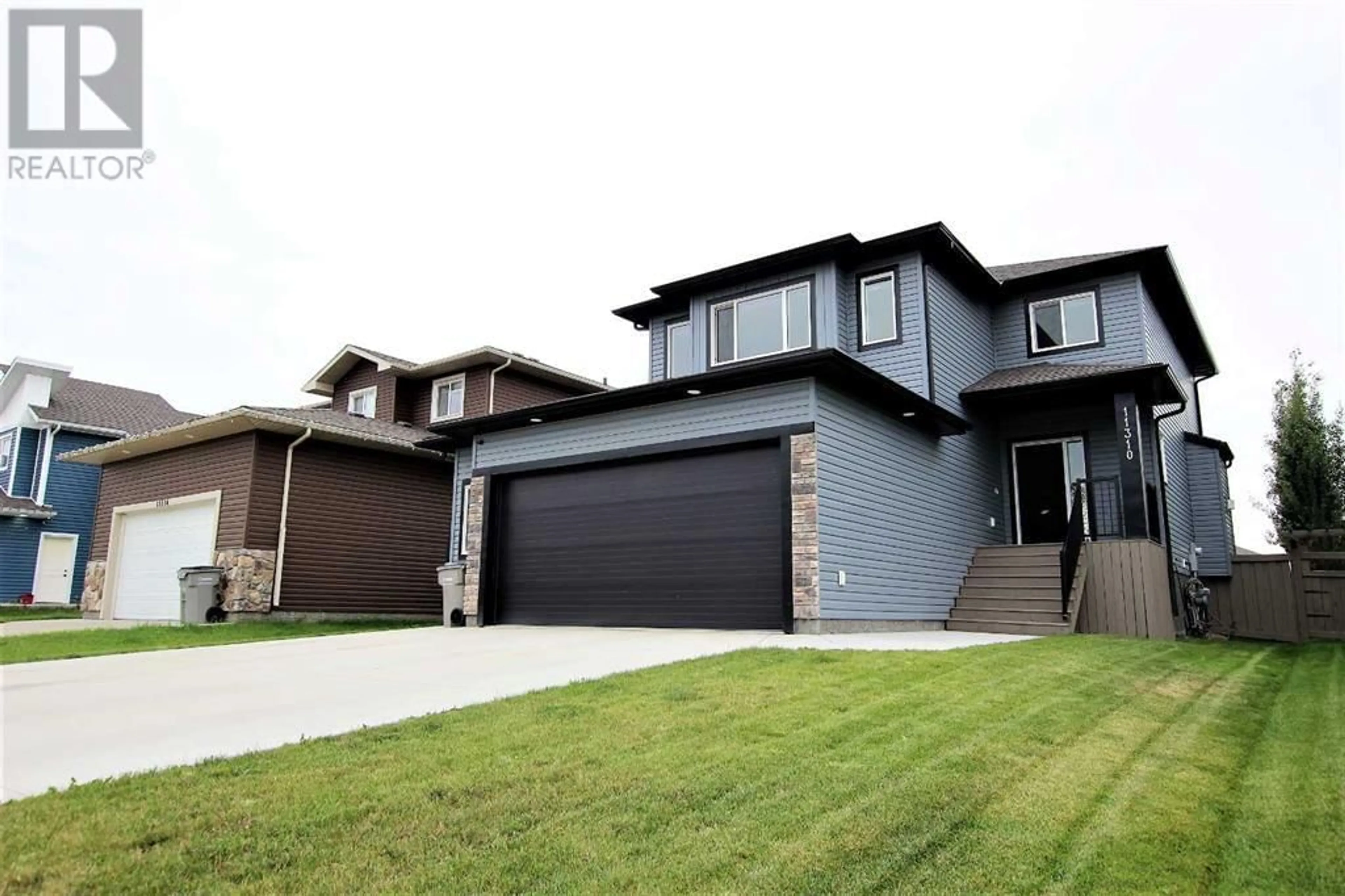 Frontside or backside of a home for 11310 62 Avenue, Grande Prairie Alberta T8W0L3