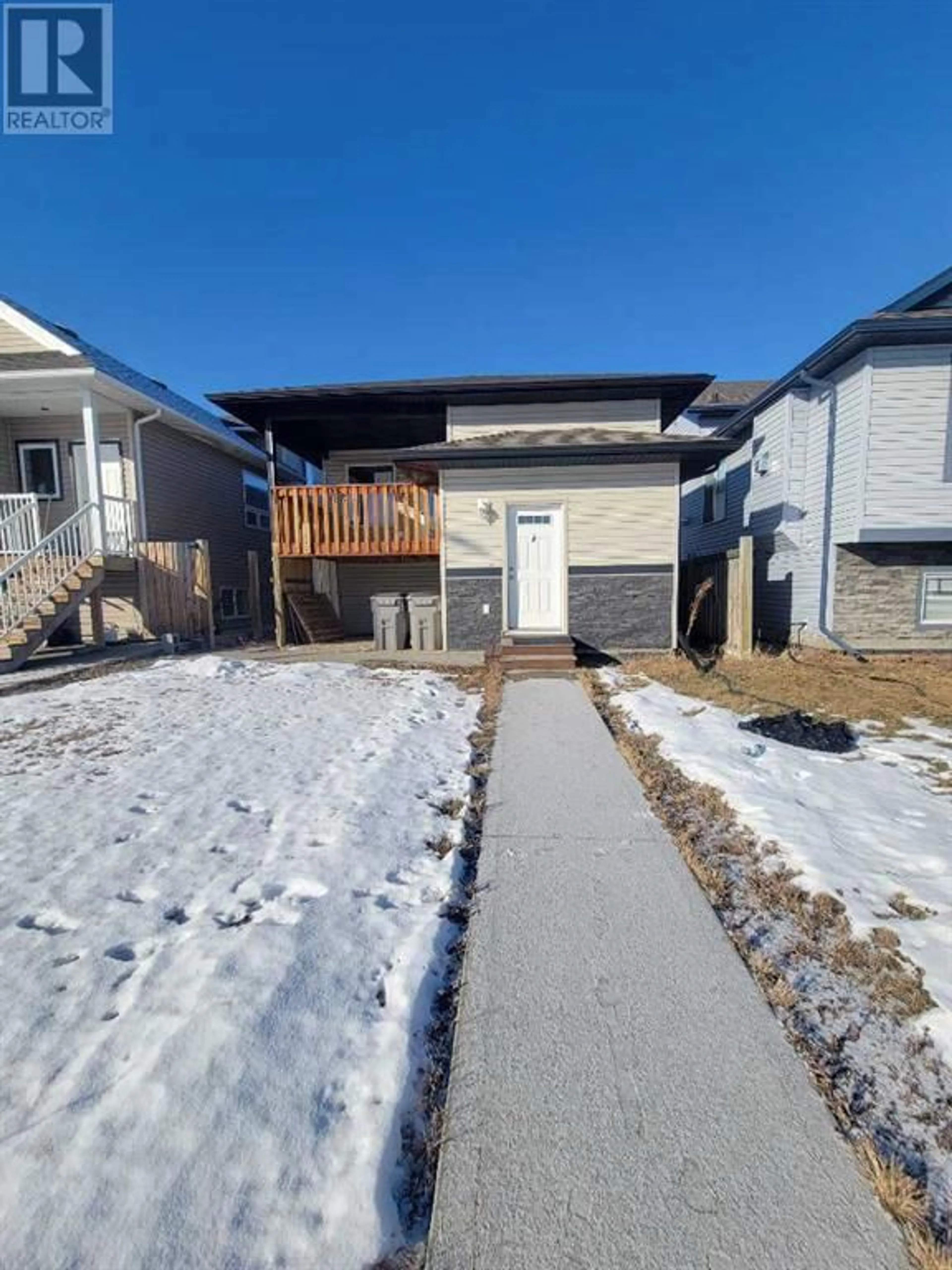 Frontside or backside of a home for 11542 76 Avenue, Grande Prairie Alberta T8W0B6