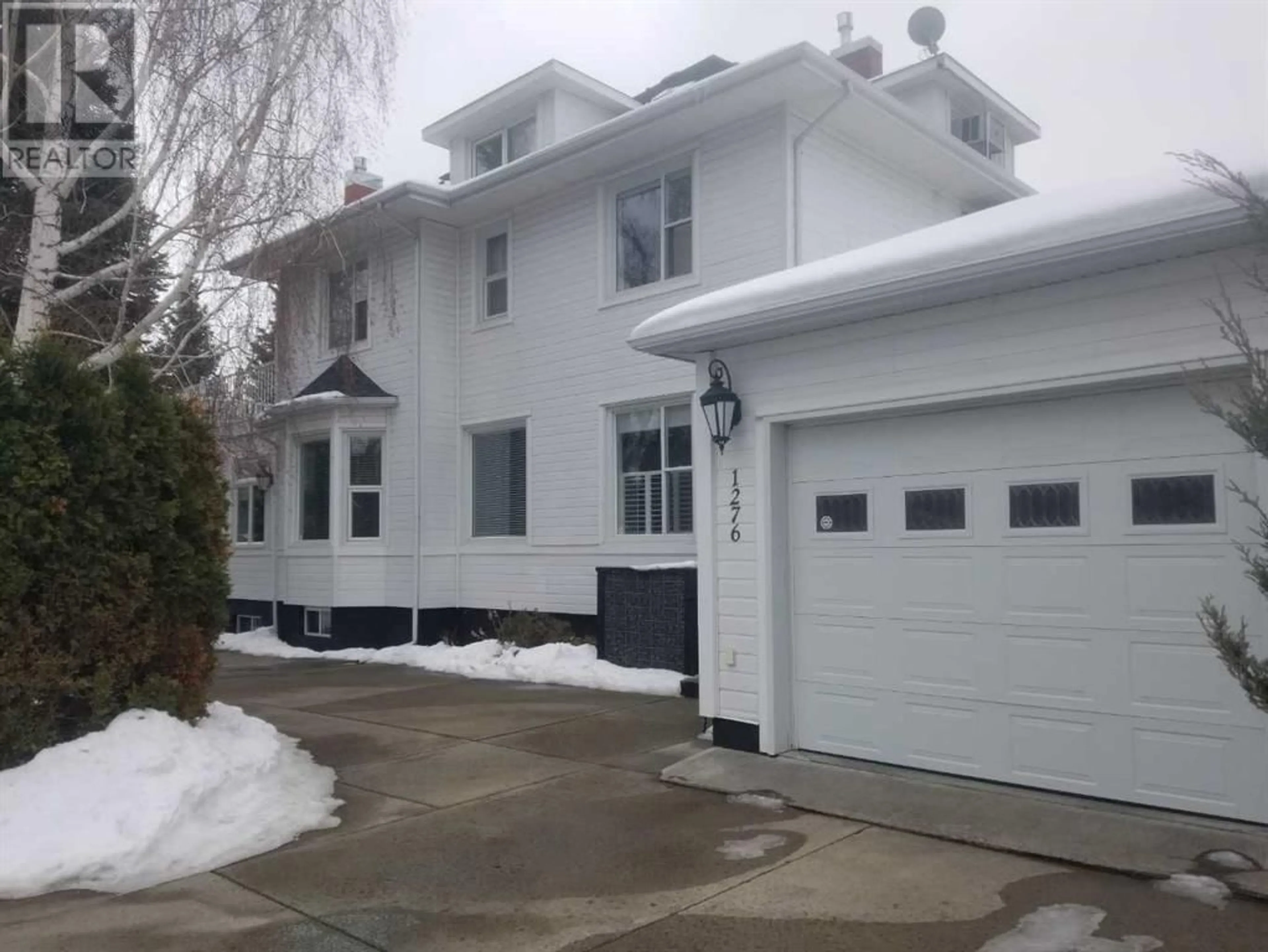 Frontside or backside of a home for 1276 5 Avenue S, Lethbridge Alberta T1J0V5
