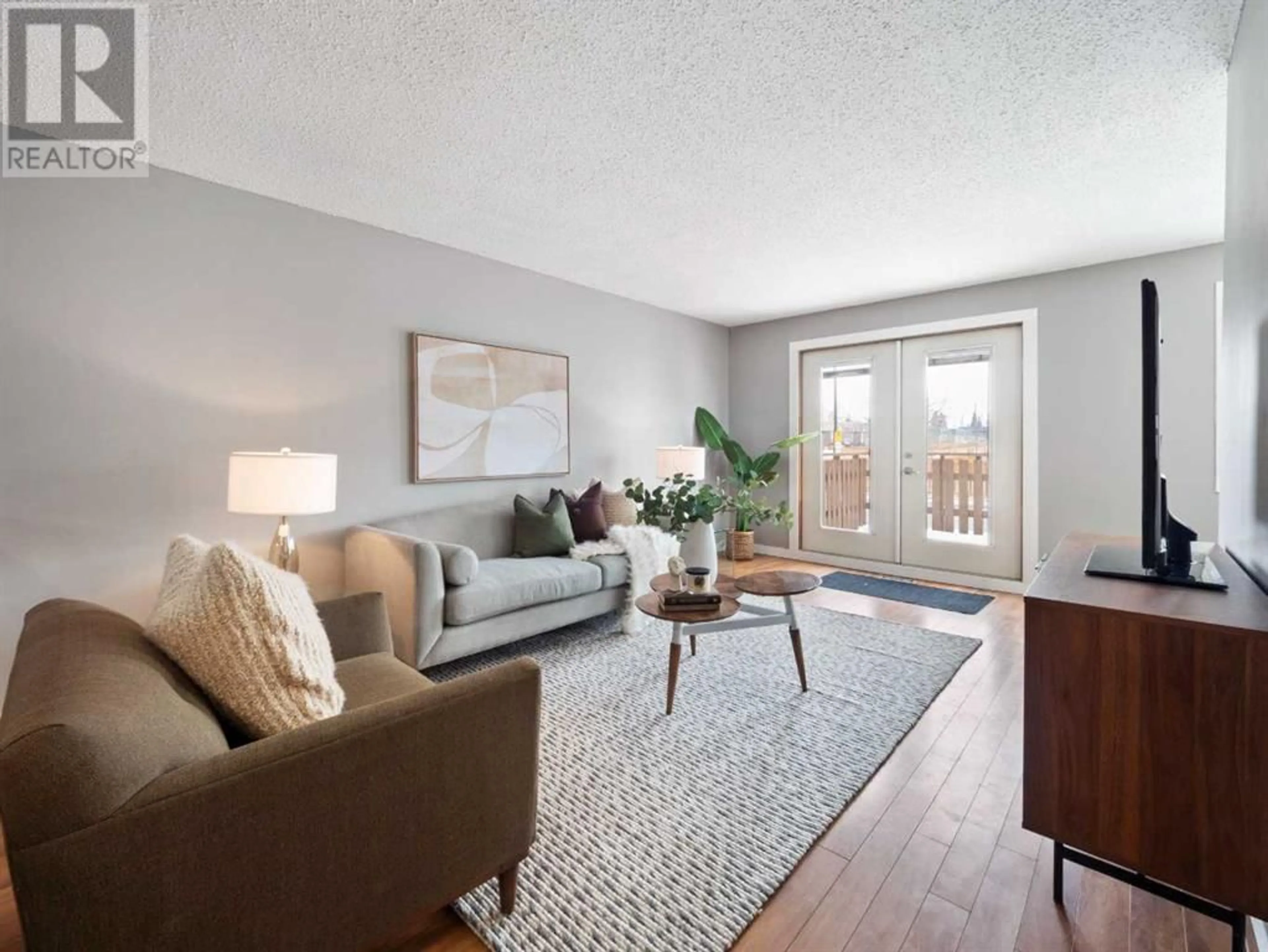 Living room for A 2737 78 Avenue SE, Calgary Alberta T2C1M4