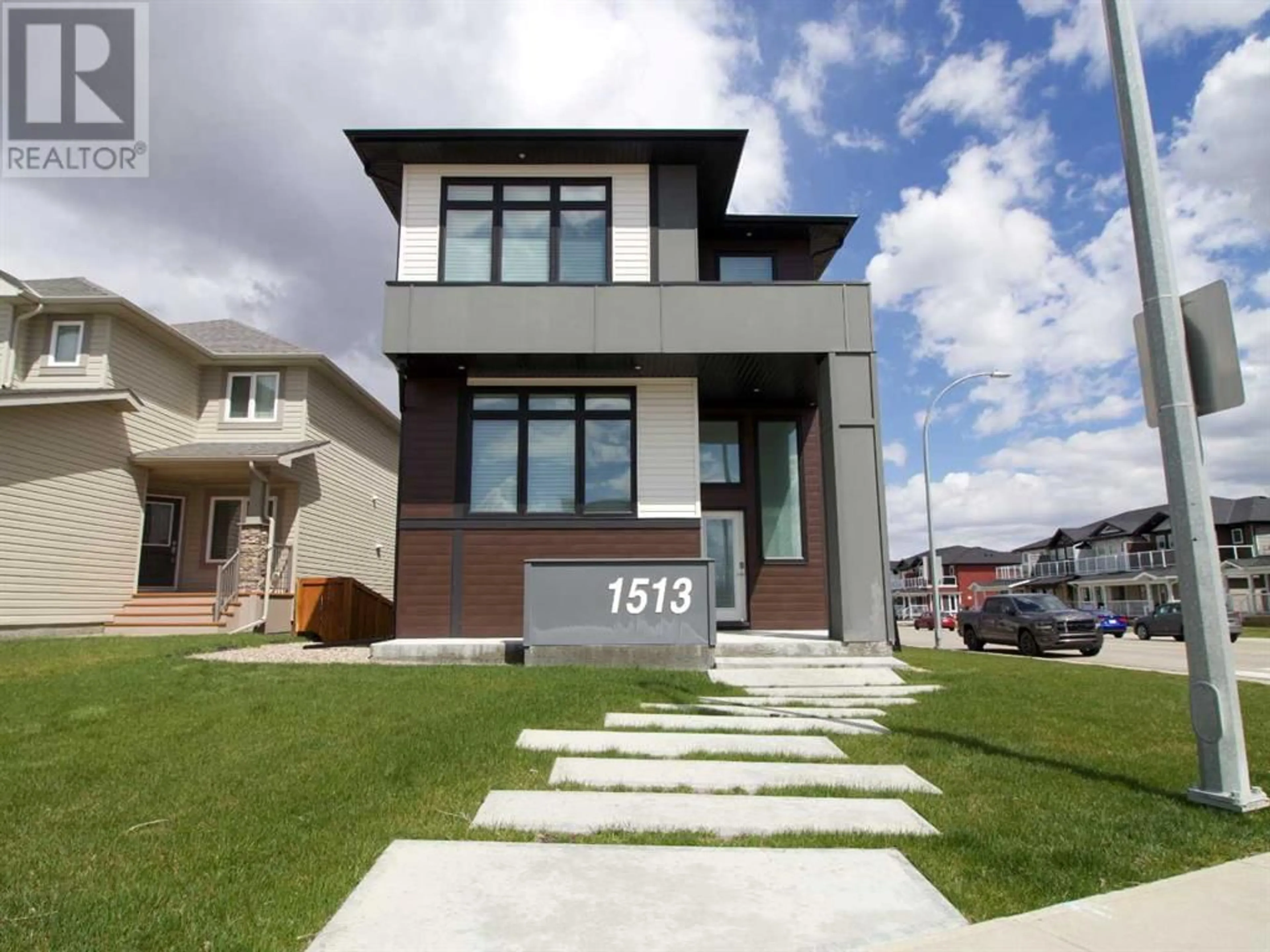 Home with brick exterior material for 1513 Coalbanks Boulevard W, Lethbridge Alberta T1J5H7