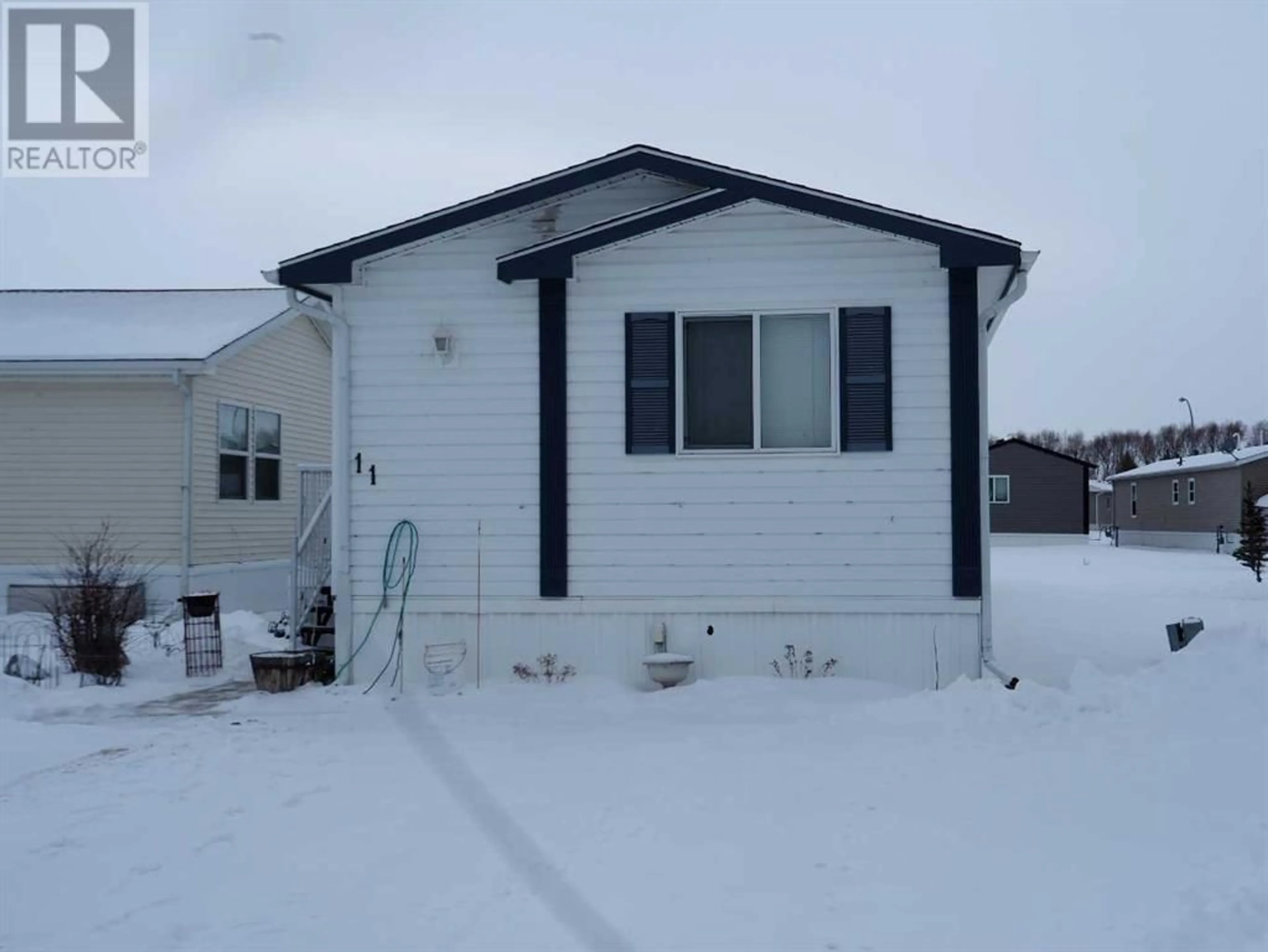 Home with unknown exterior material for 11 15 MACKENZIE RANCH Way, Lacombe Alberta T4L0B4