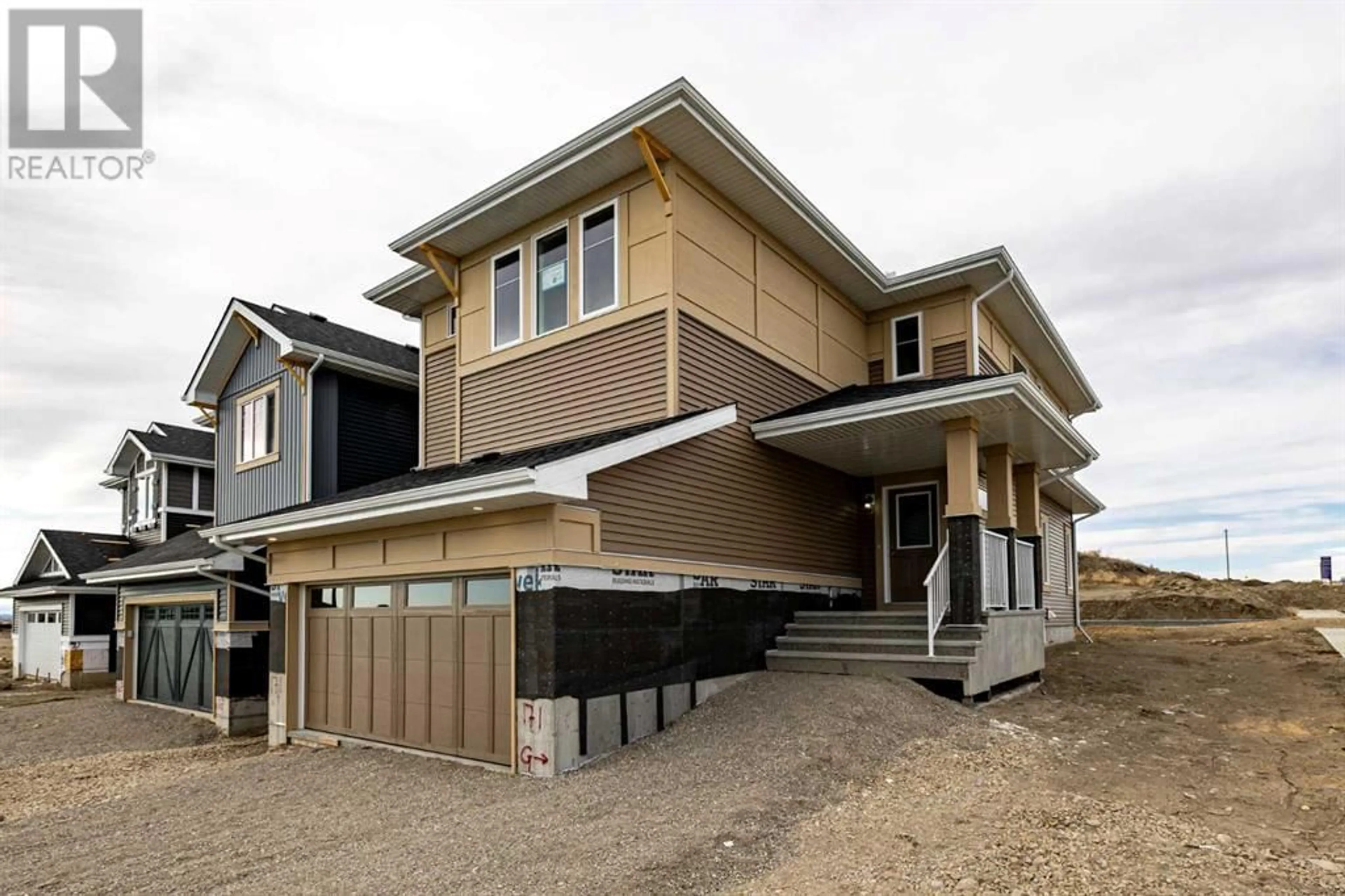 Home with vinyl exterior material for 171 Sundown Crescent, Cochrane Alberta T2T2T2