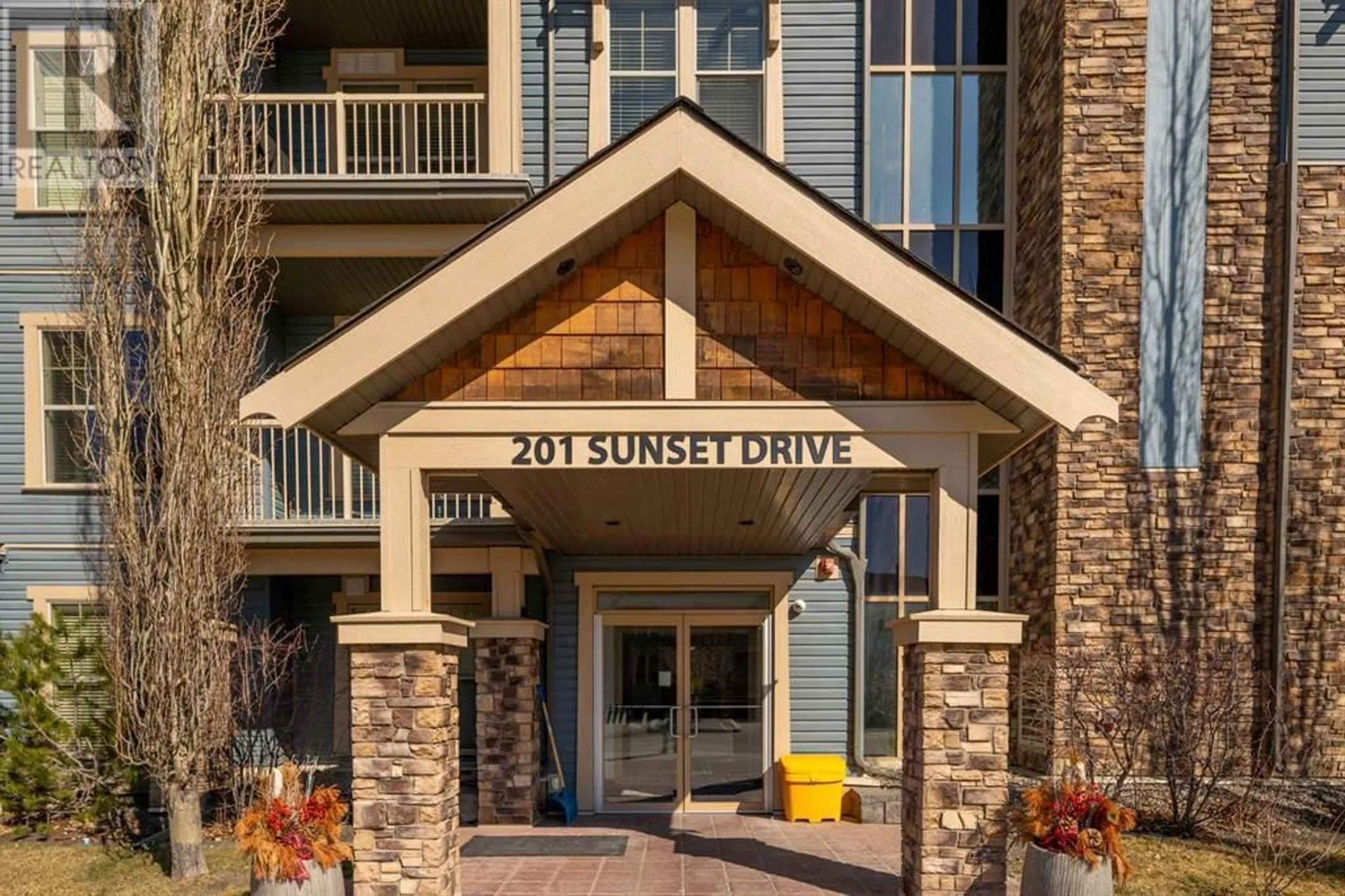 A pic from exterior of the house or condo for 408 201 Sunset Drive, Cochrane Alberta T4C0H5