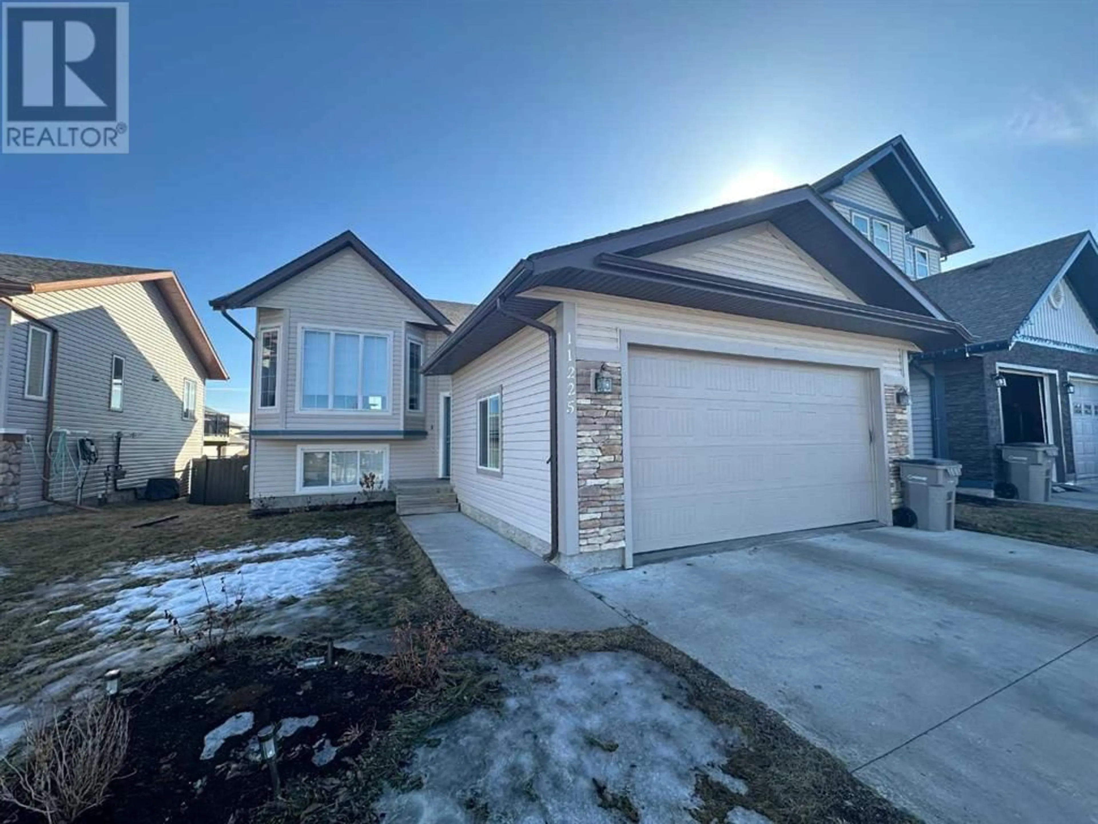 Frontside or backside of a home for 11225 80 Avenue, Grande Prairie Alberta T8W0B7