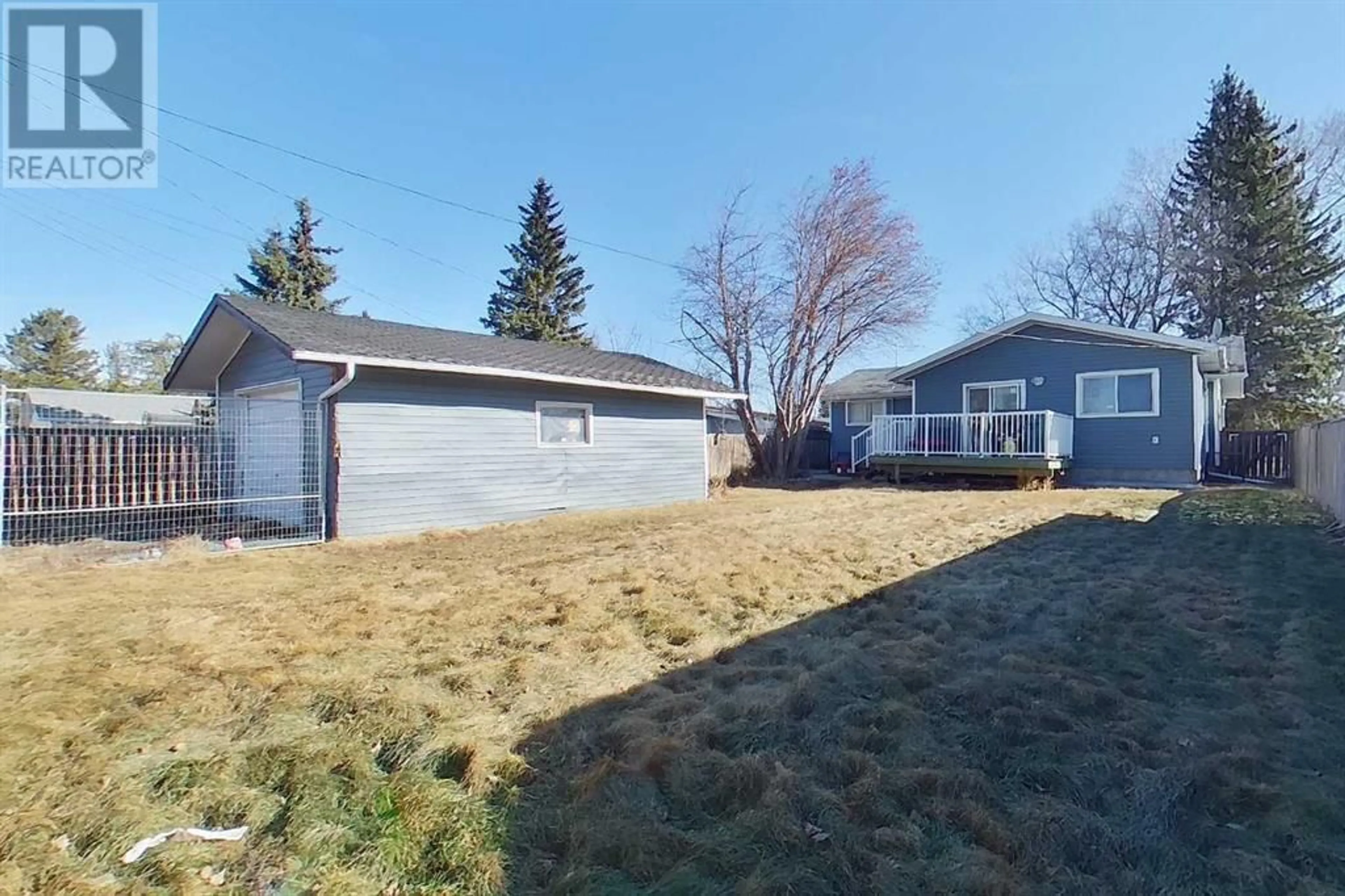 Frontside or backside of a home for 320 5 Street NE, Slave Lake Alberta T0G2A2