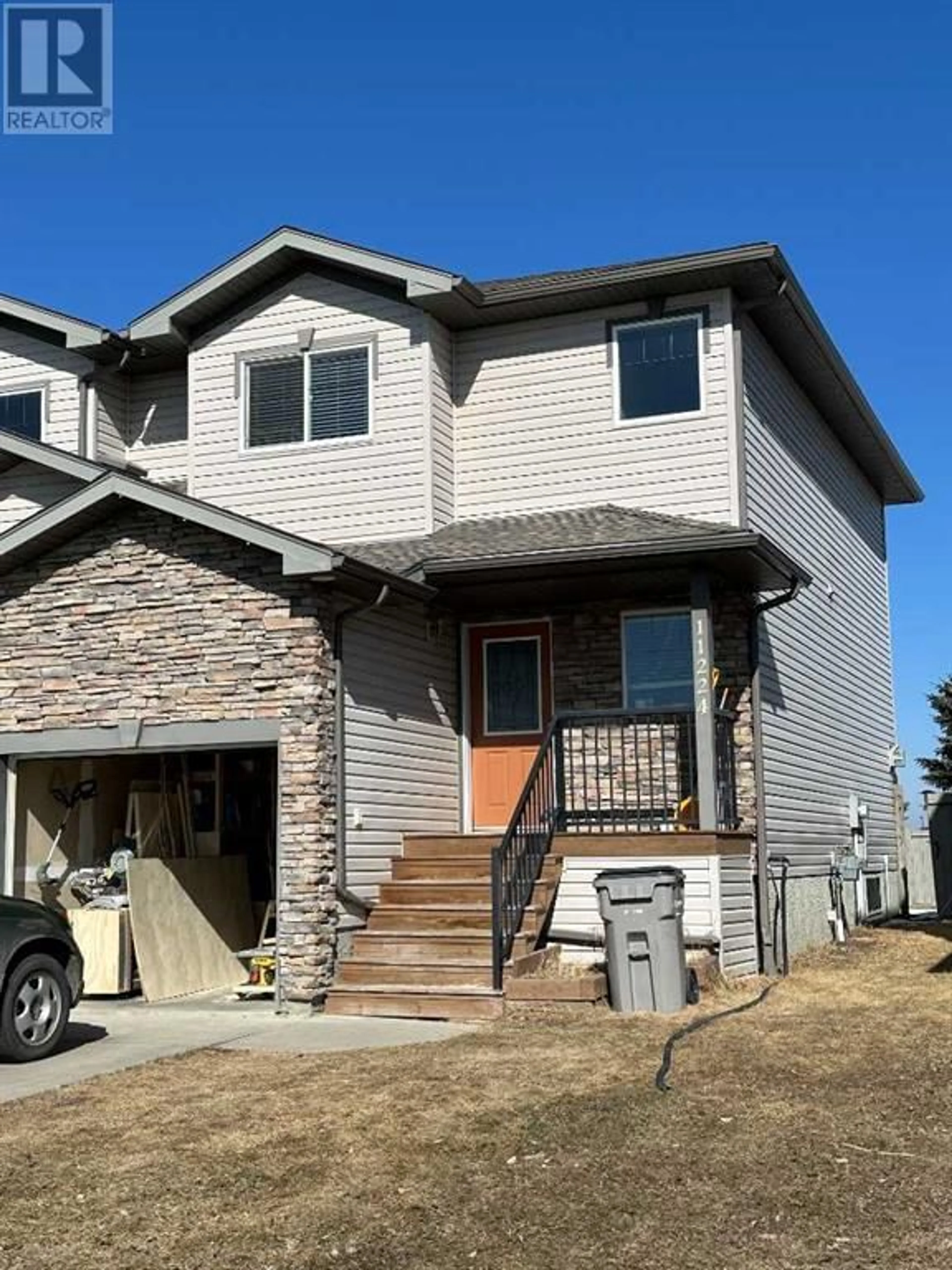 Frontside or backside of a home for 11224 71 Avenue, Grande Prairie Alberta T8W0C8