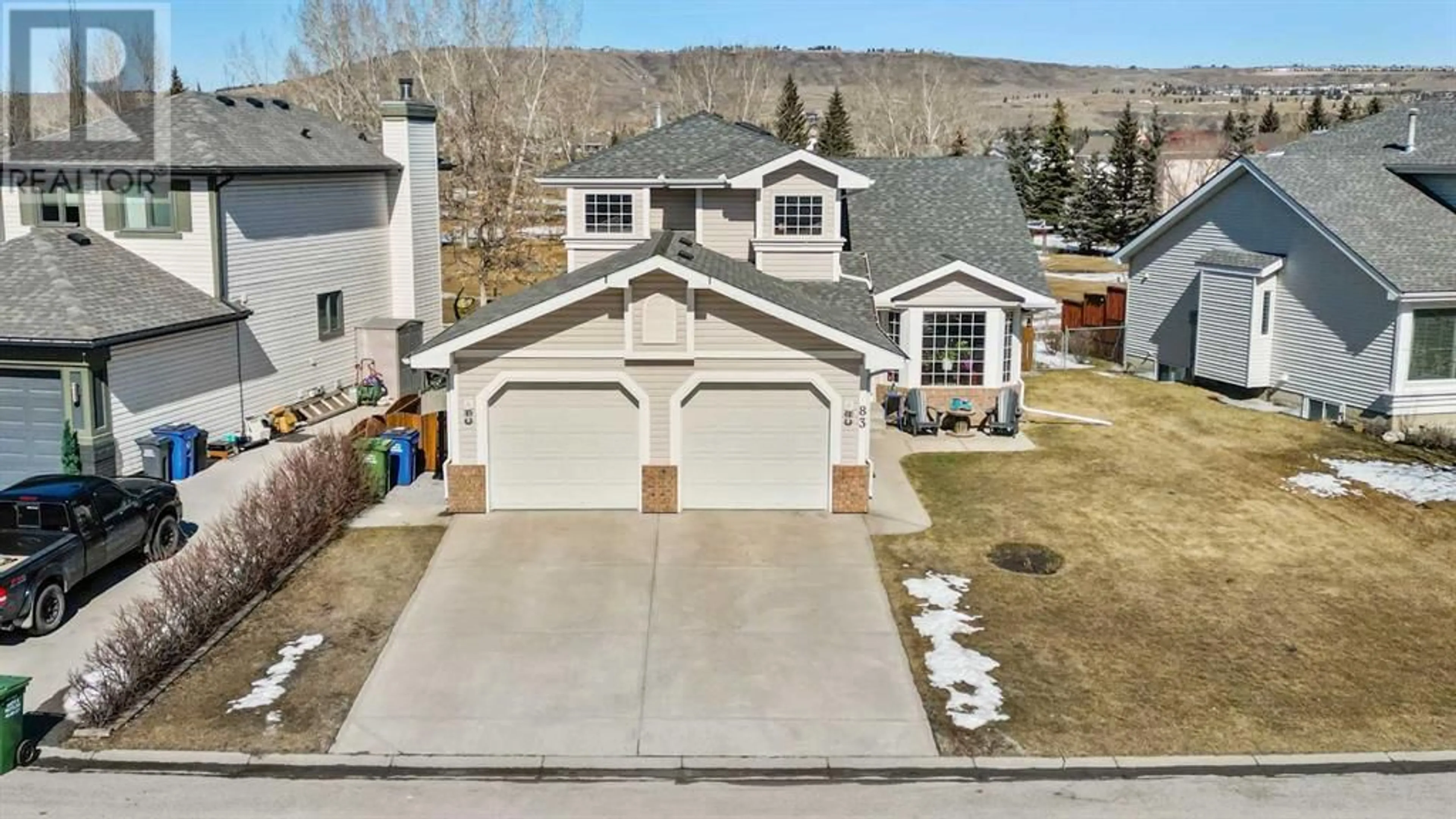 Frontside or backside of a home for 83 Riverview Circle, Cochrane Alberta T4C1K4