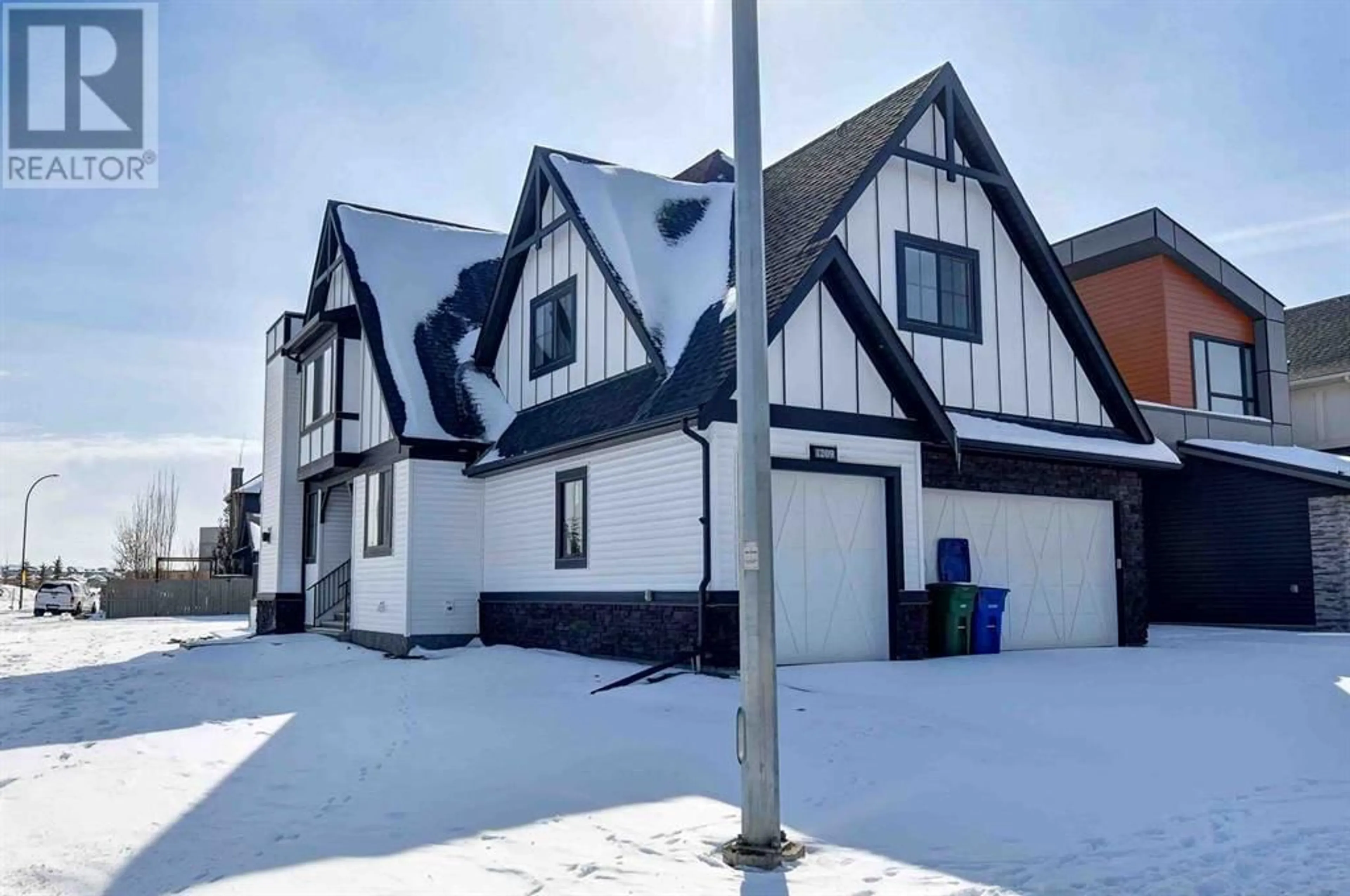 Frontside or backside of a home for 1209 Coopers Drive SW, Airdrie Alberta T4B0G7
