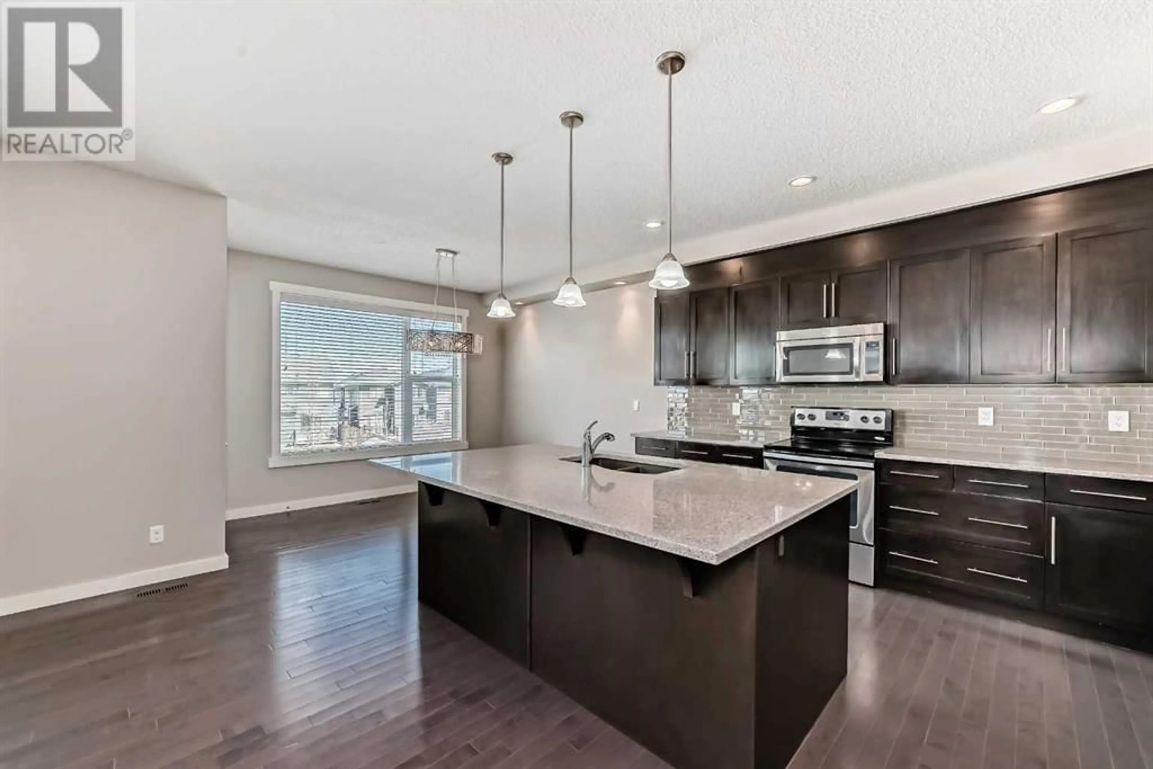 Contemporary kitchen for 554 Sherwood Boulevard NW, Calgary Alberta T3R1M9