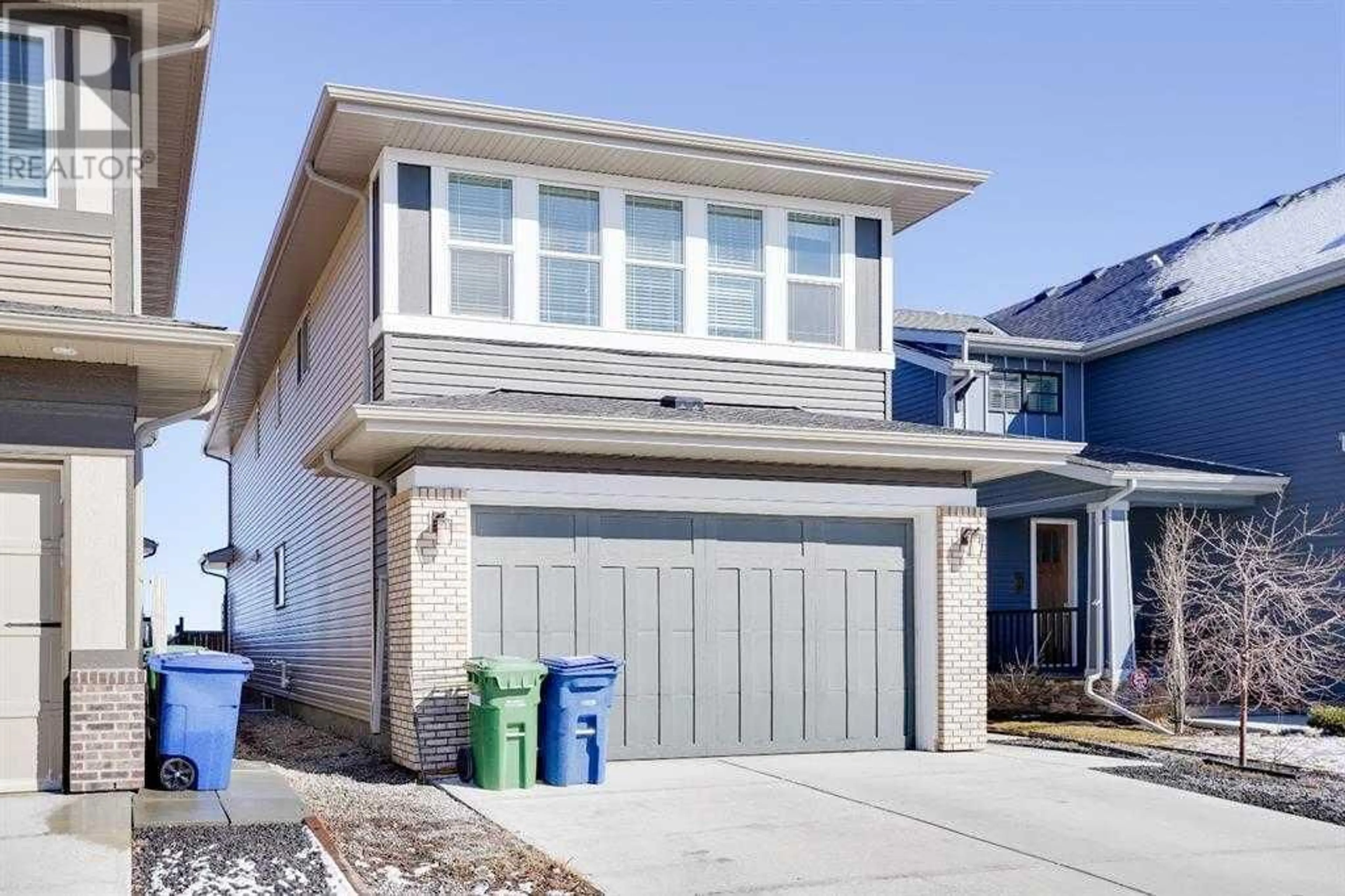 Frontside or backside of a home for 202 Reunion Green NW, Airdrie Alberta T4B3W3