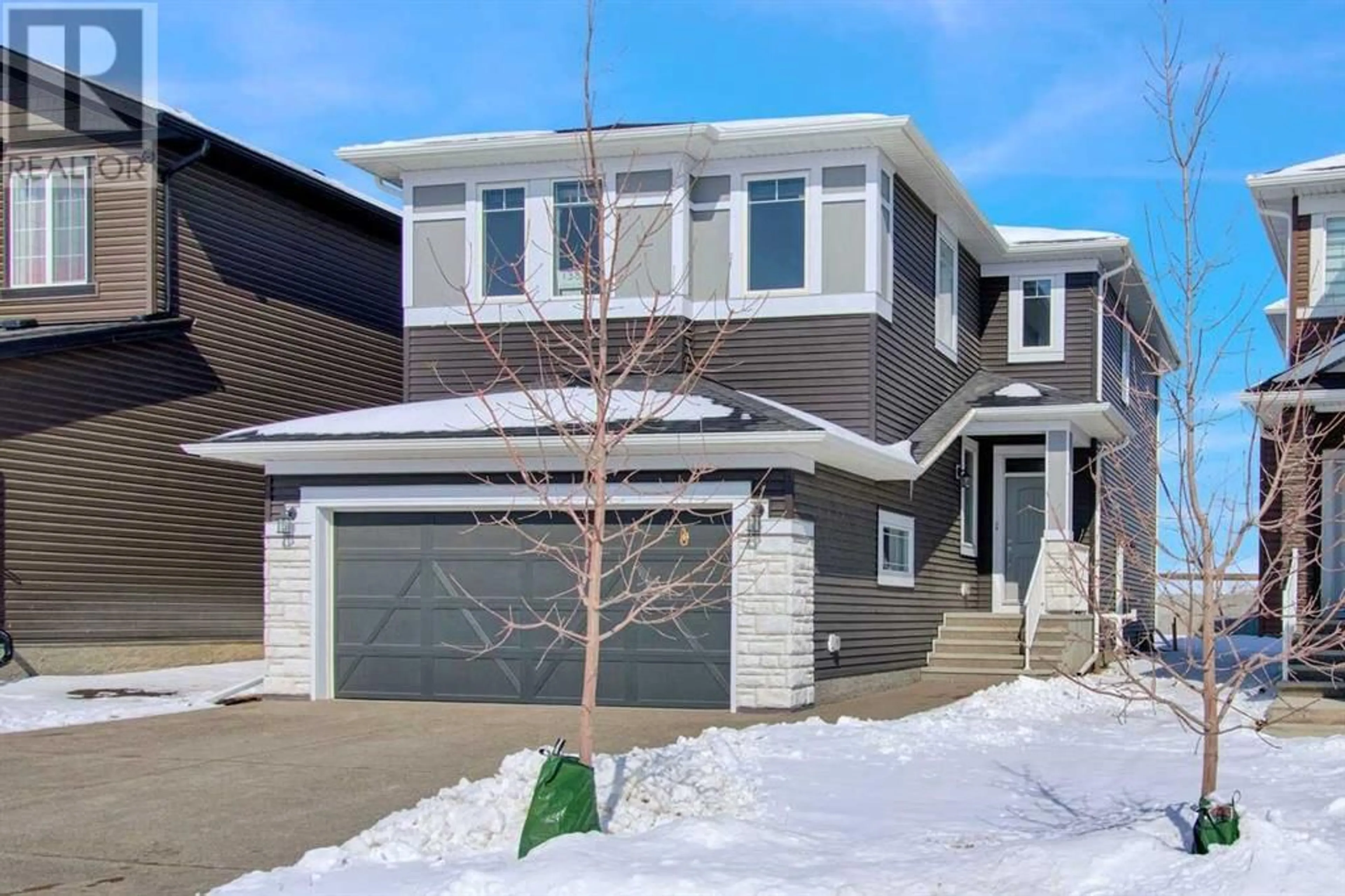 Frontside or backside of a home for 138 Creekside Way SW, Calgary Alberta T2X4B1