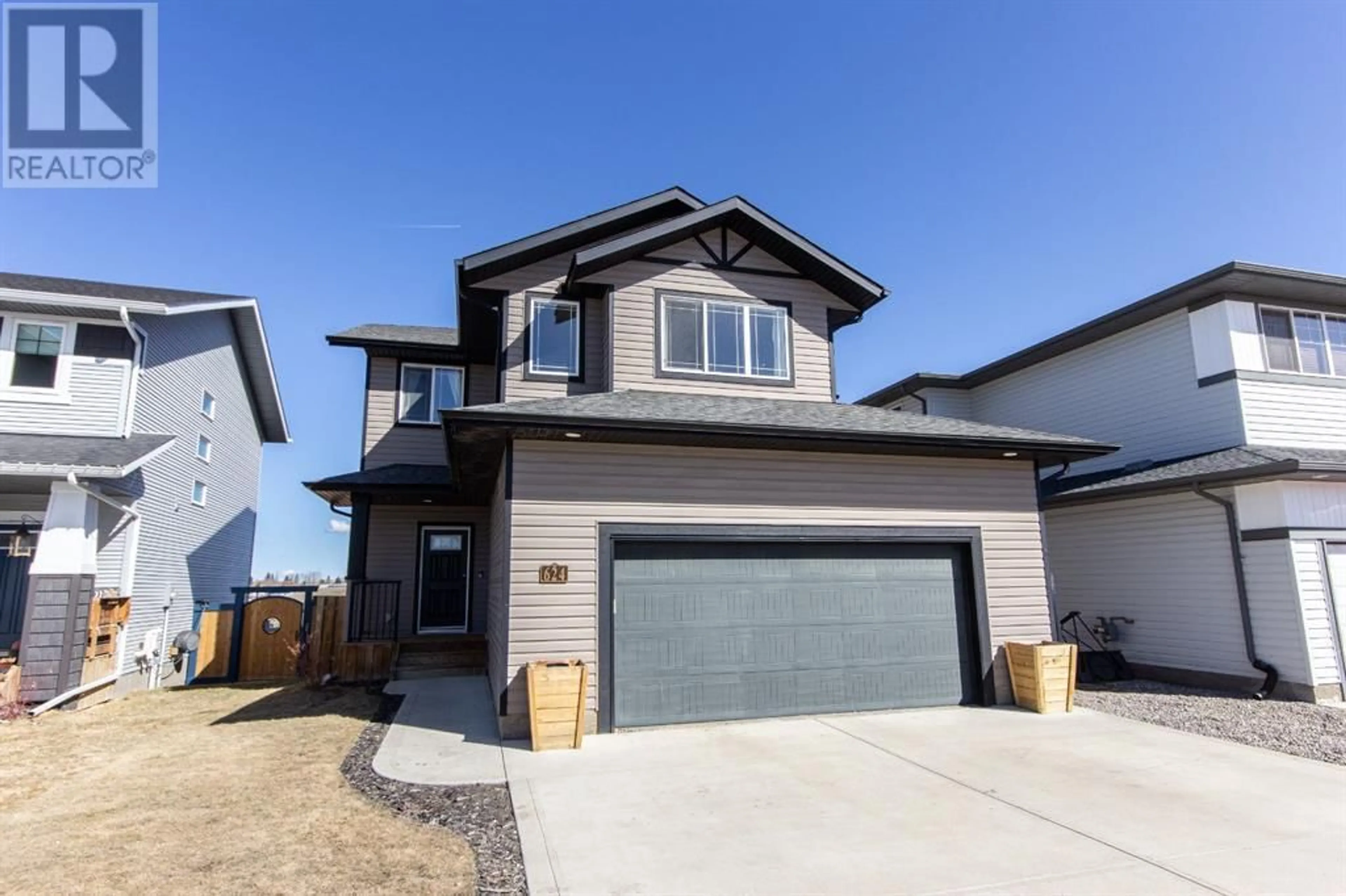 Frontside or backside of a home for 624 Robinson Avenue, Penhold Alberta T0M1R0