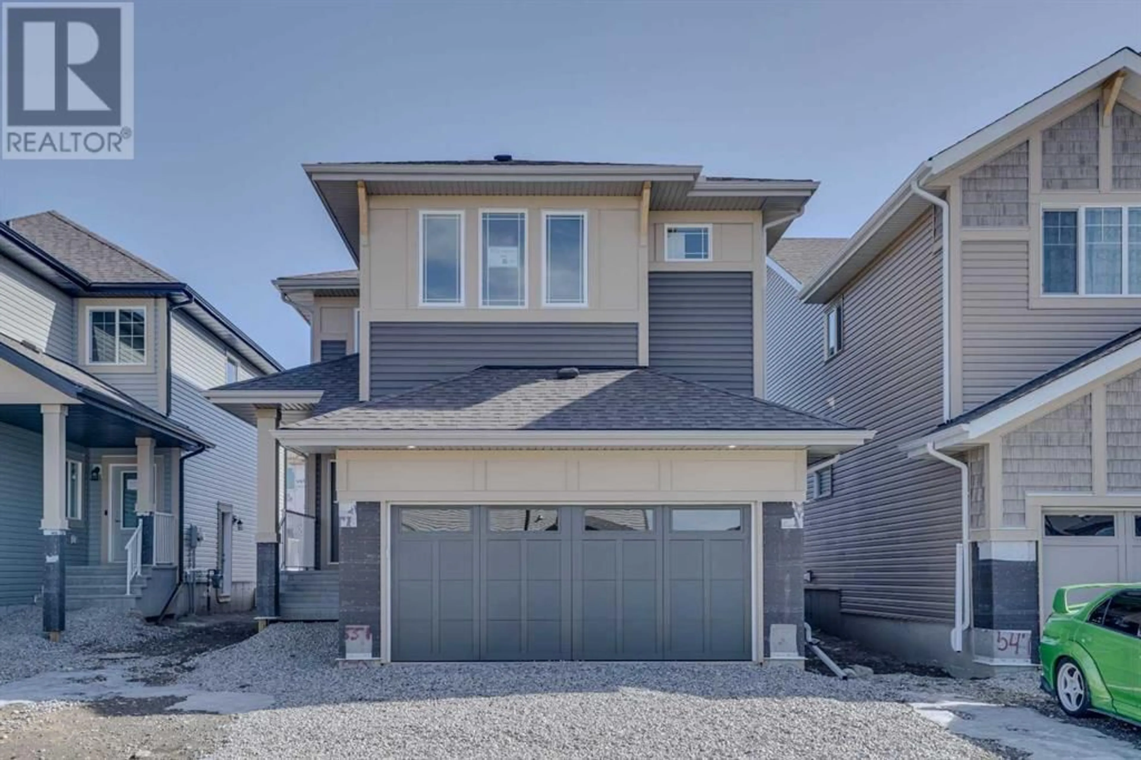 Frontside or backside of a home for 551 Clydesdale Way, Cochrane Alberta T4C3B6