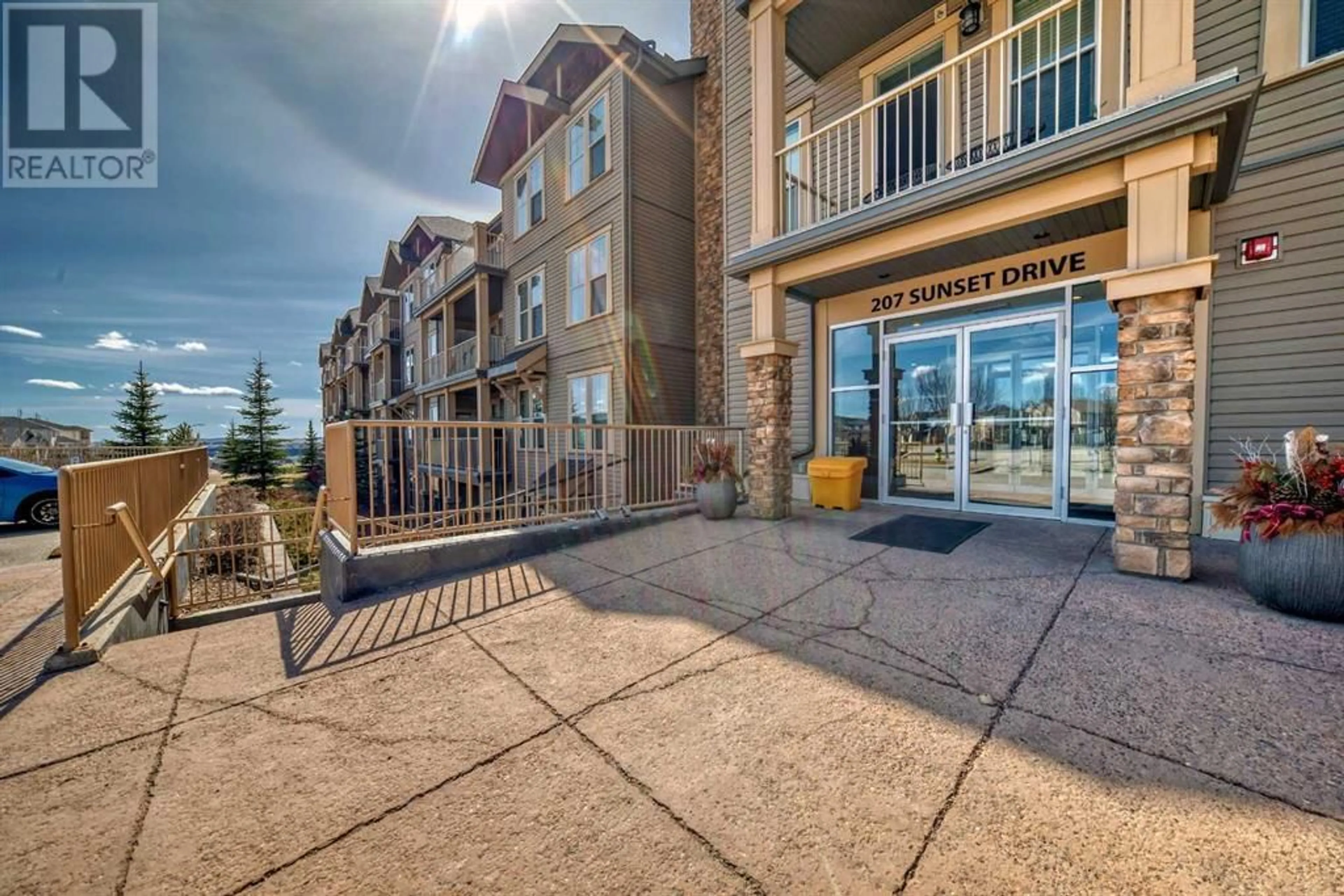 A pic from exterior of the house or condo for 323 207 Sunset Drive, Cochrane Alberta T4C0H7