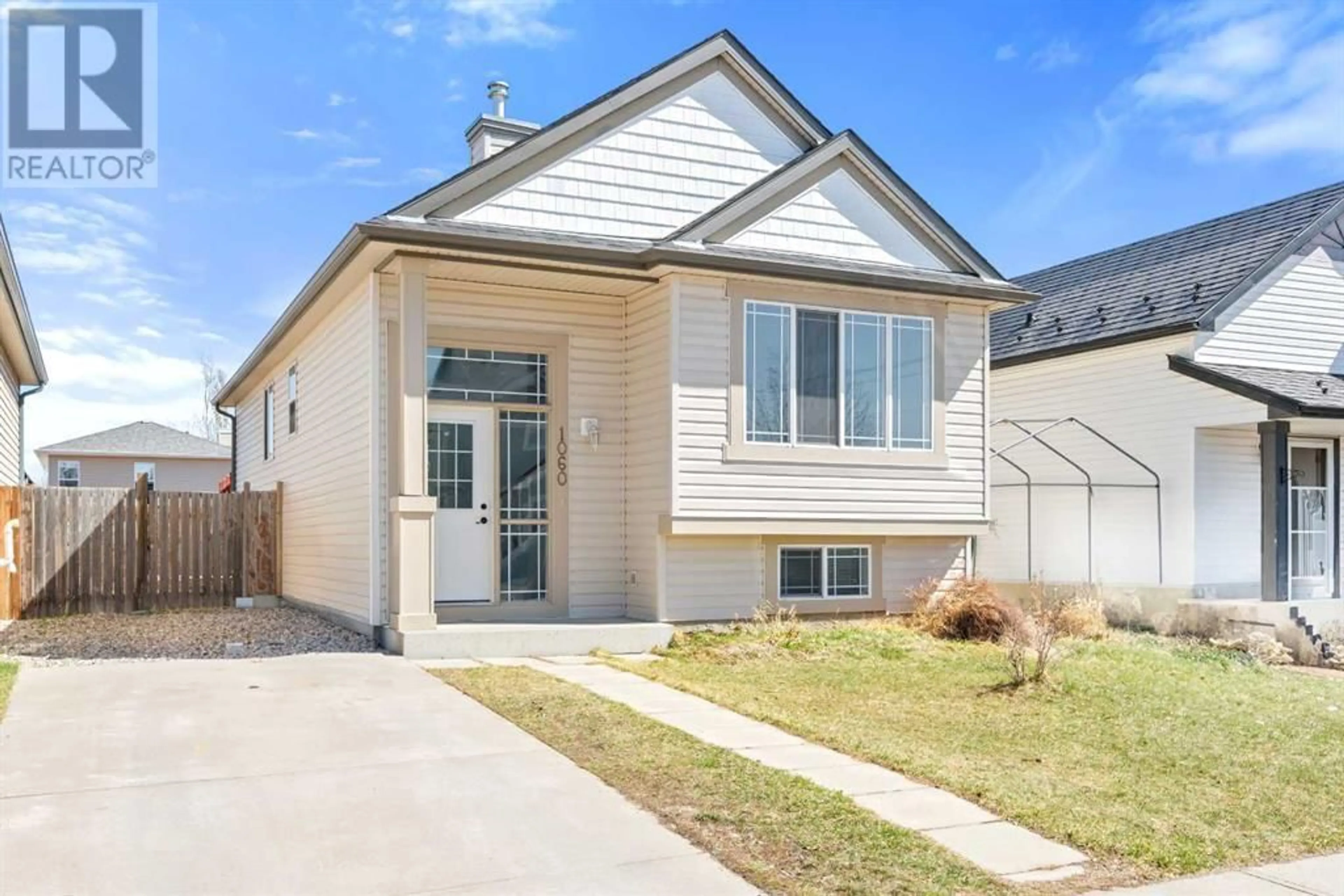 Frontside or backside of a home for 1060 Bridlemeadows Manor SW, Calgary Alberta T2Y4L1