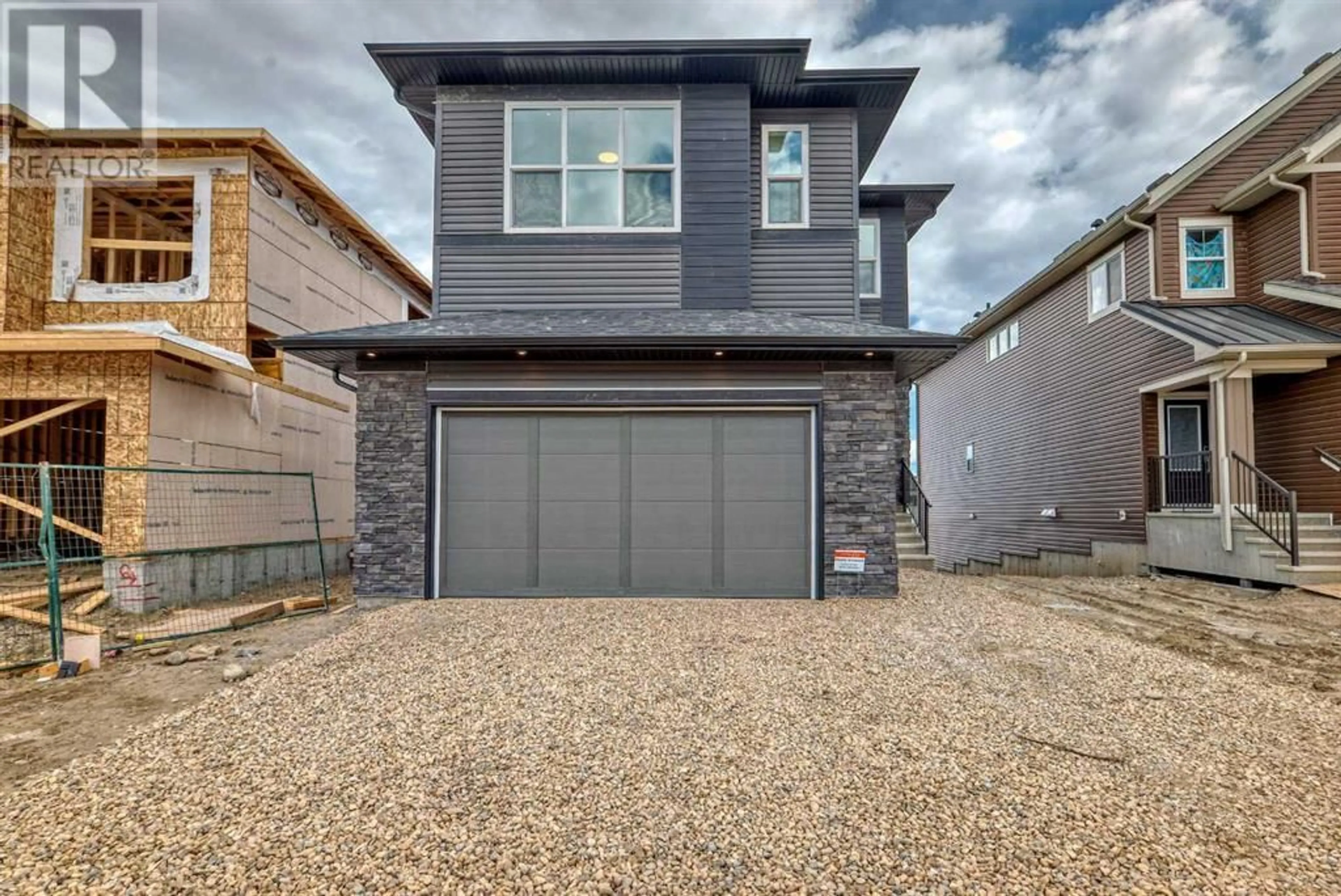 Home with brick exterior material for 196 Calhoun Crescent NE, Calgary Alberta T3P2G1